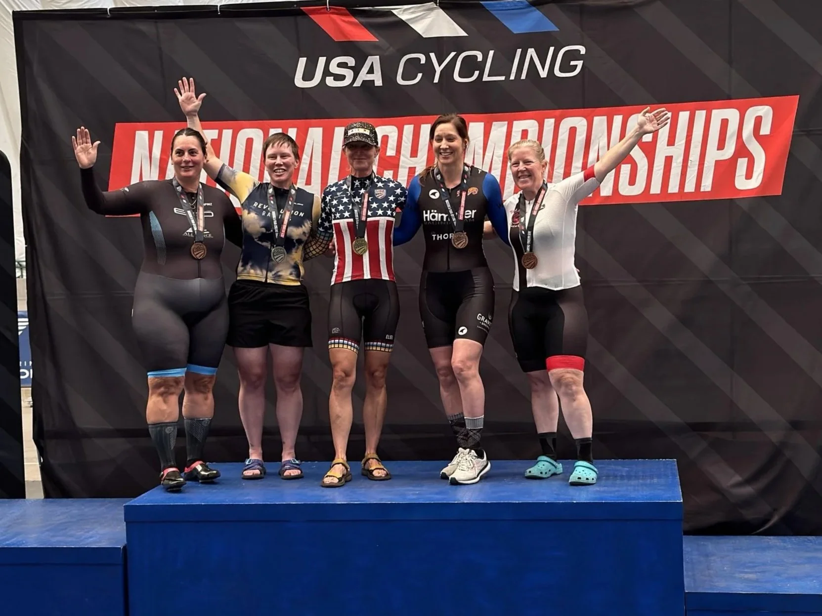 Five women cyclists of all body types on podium with medals at USA Cycling National Championship
