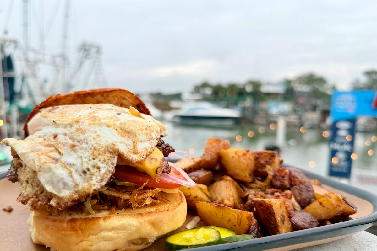 Breakfast burger served at Saltwater Cowboys waterfront brunch on Shem Creek