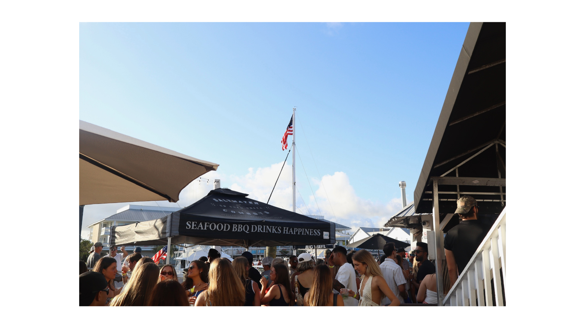 A crowd enjoying spring weather at Saltwater Cowboys’ waterfront restaurant in Charleston.