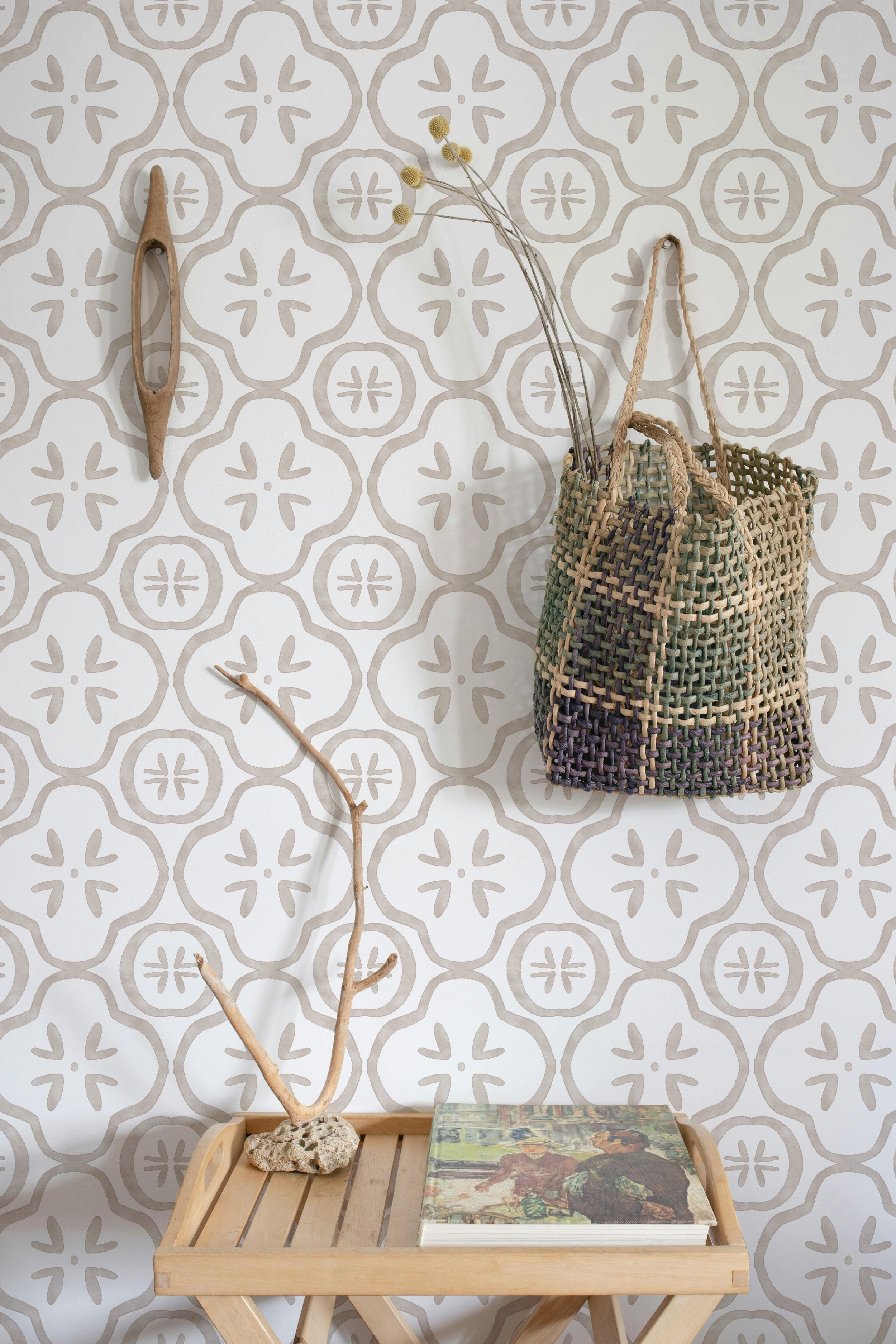Original neutral Portuguese tile inspired wallpaper featuring hand painted beige ceramic motifs displayed in a warm, modern entryway.