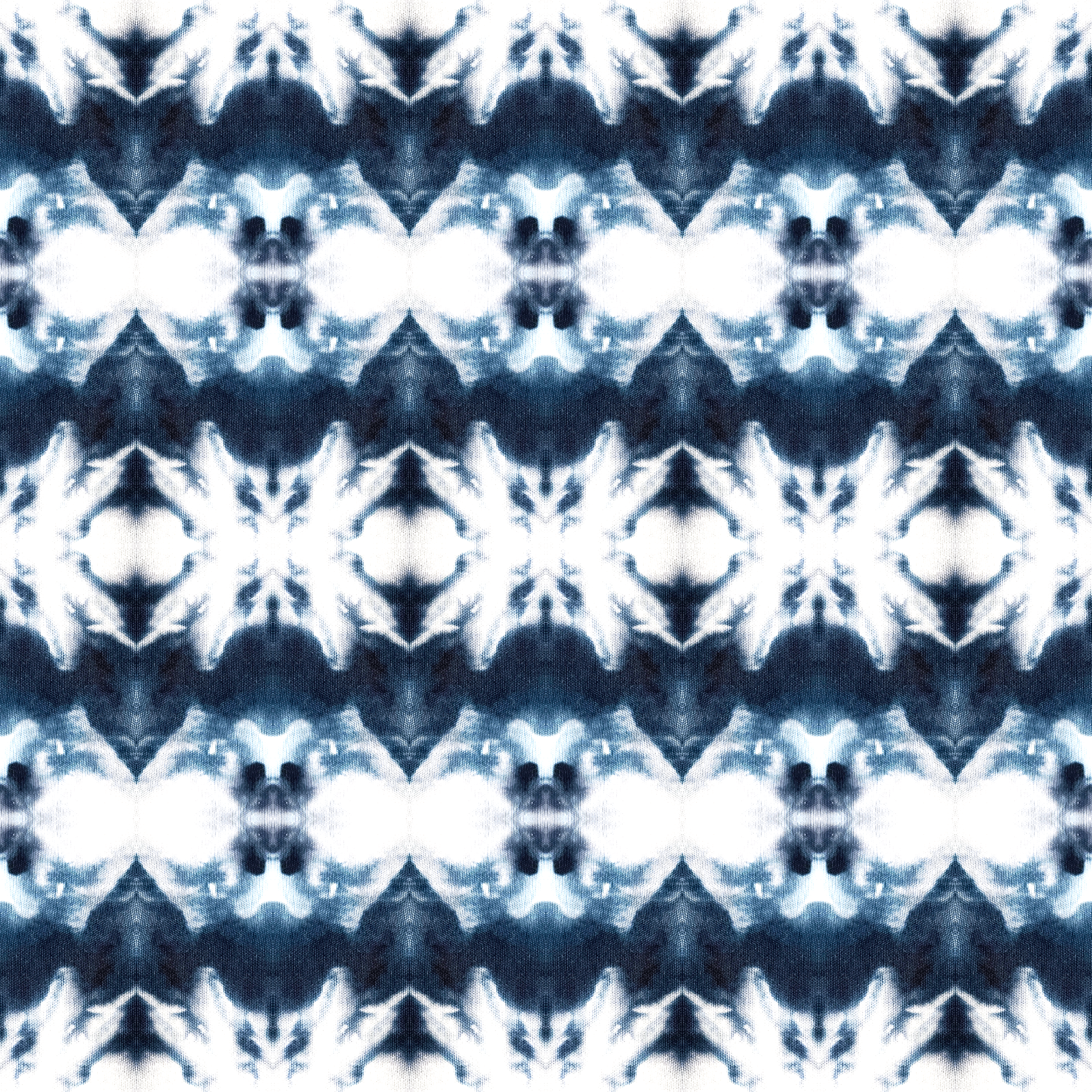 Hand dyed indigo shibori print with painterly texture and a seamless repeating layout.