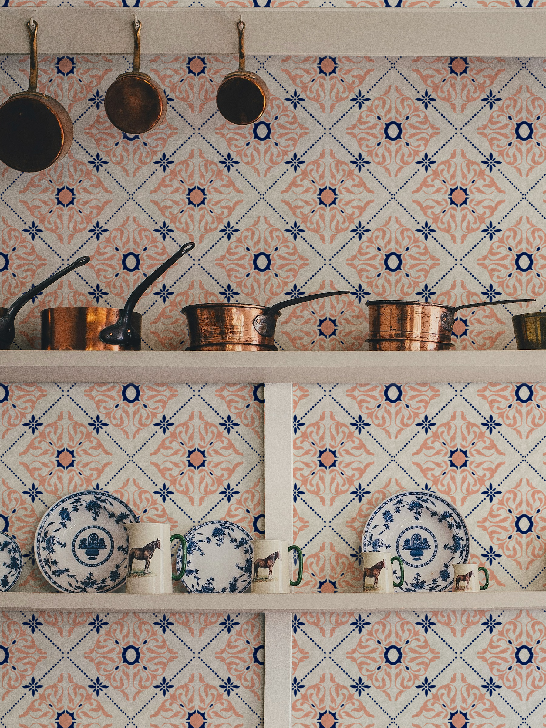 Original Portuguese azulejo tile wallpaper inspired by traditional hand painted ceramic tiles in blue and terracotta, shown in a classic kitchen.