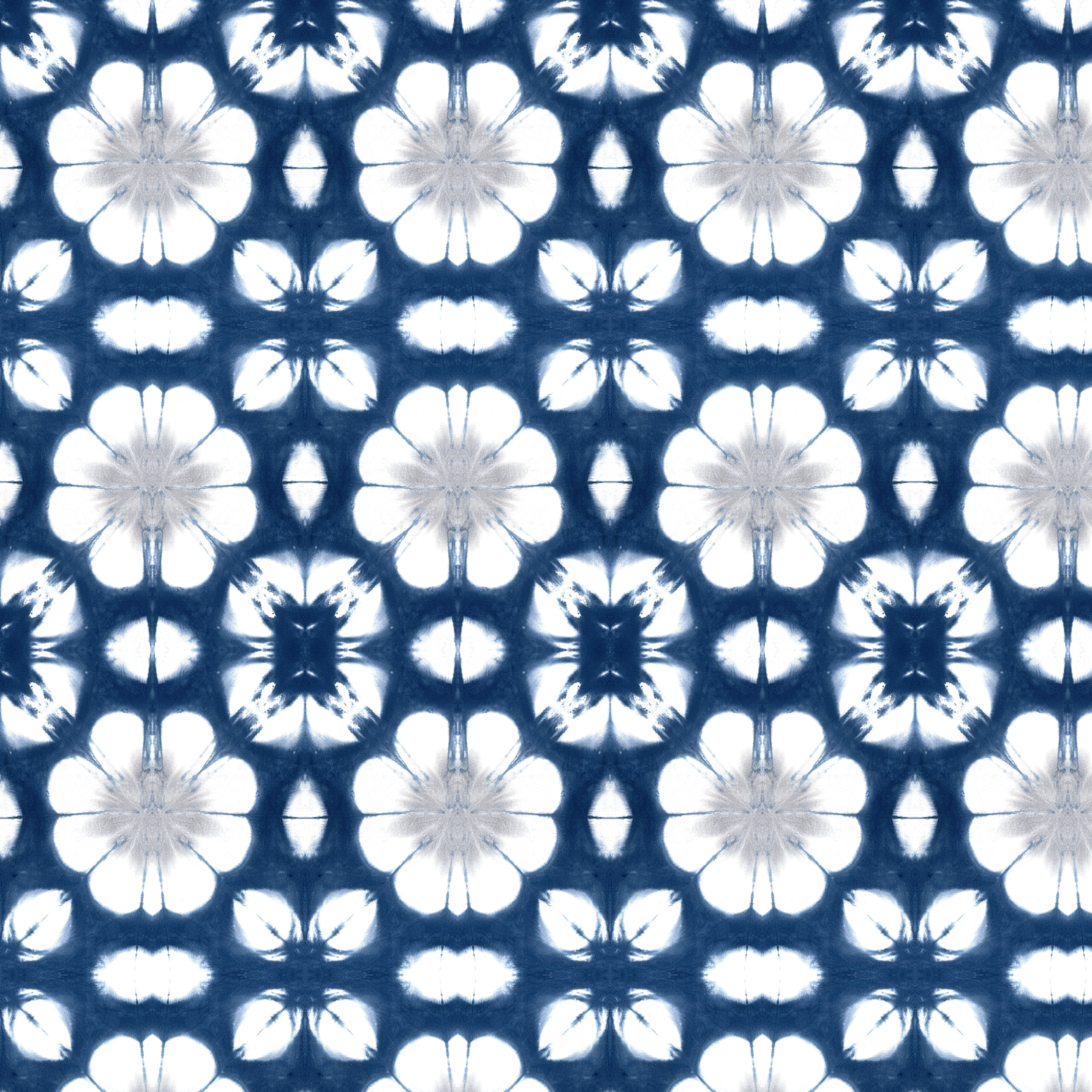Abstract indigo flowers textile design with layered hand dyed textures in a seamless repeat.