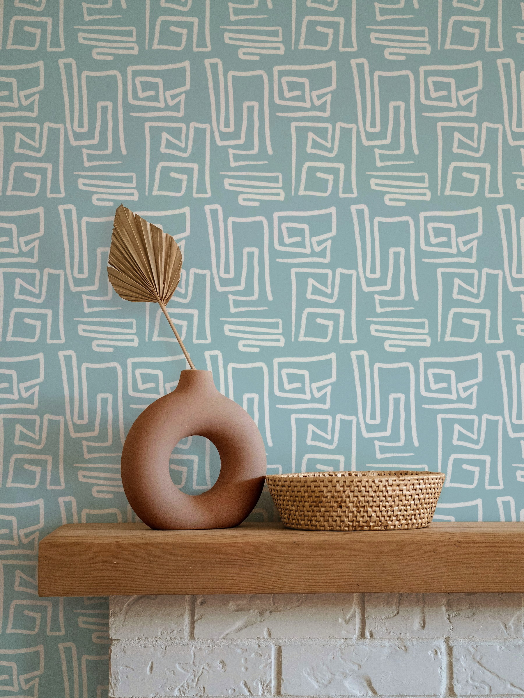 Original geometric wallpaper by Dyes Happy featuring hand painted abstract lines in soft blue and white shown in a modern styled interior.