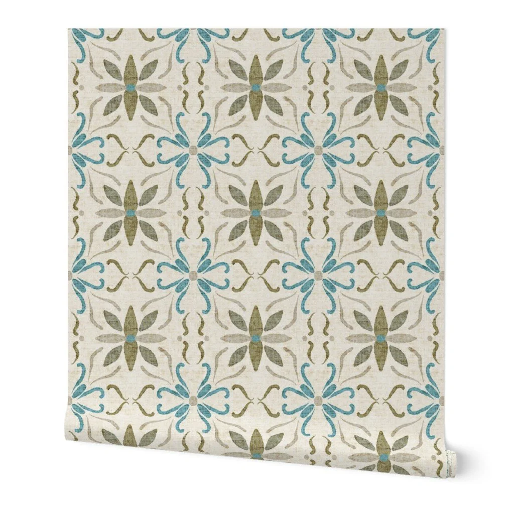 Wallpaper sample featuring a watercolor Mediterranean tile design in sage green, aqua blue, and warm linen with a vintage ceramic look.