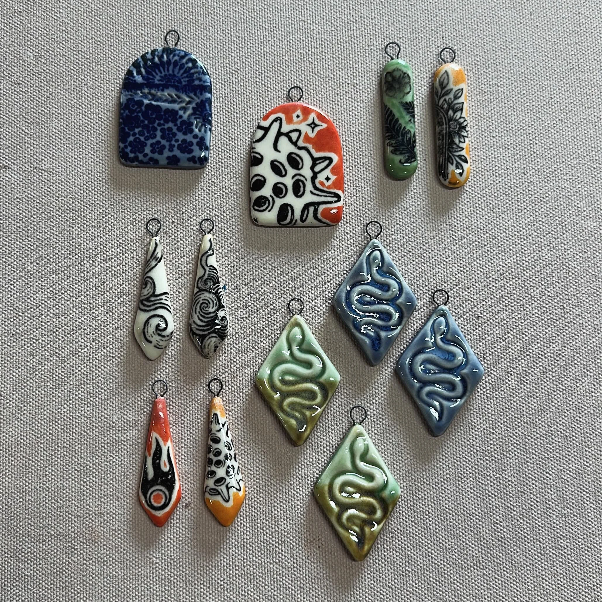 Fiiiinally finished these pieces for a workshop like&hellip; 6 months ago lmao. I wanted them to be glazed on both sides so I had a make (not buy like a normal person would) a jewelry tree to fire them. Some were lost along the way, but all my favori