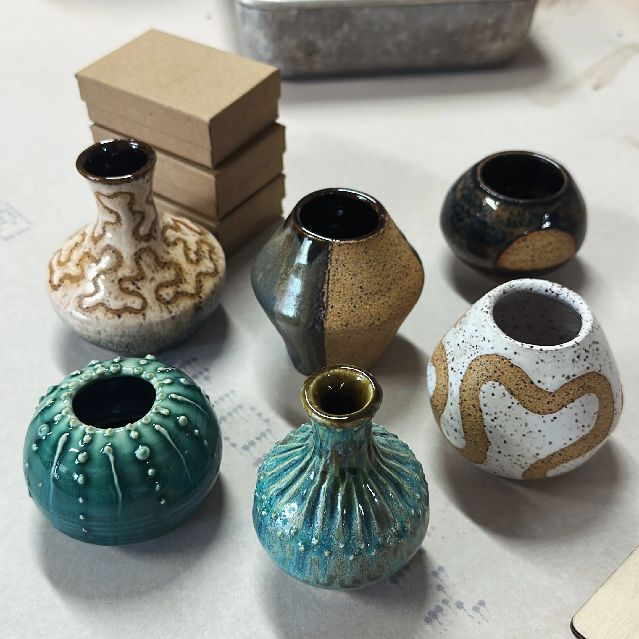 Some lil babies out of the kiln - first time using speckled buff and some slip trailed porcelain.