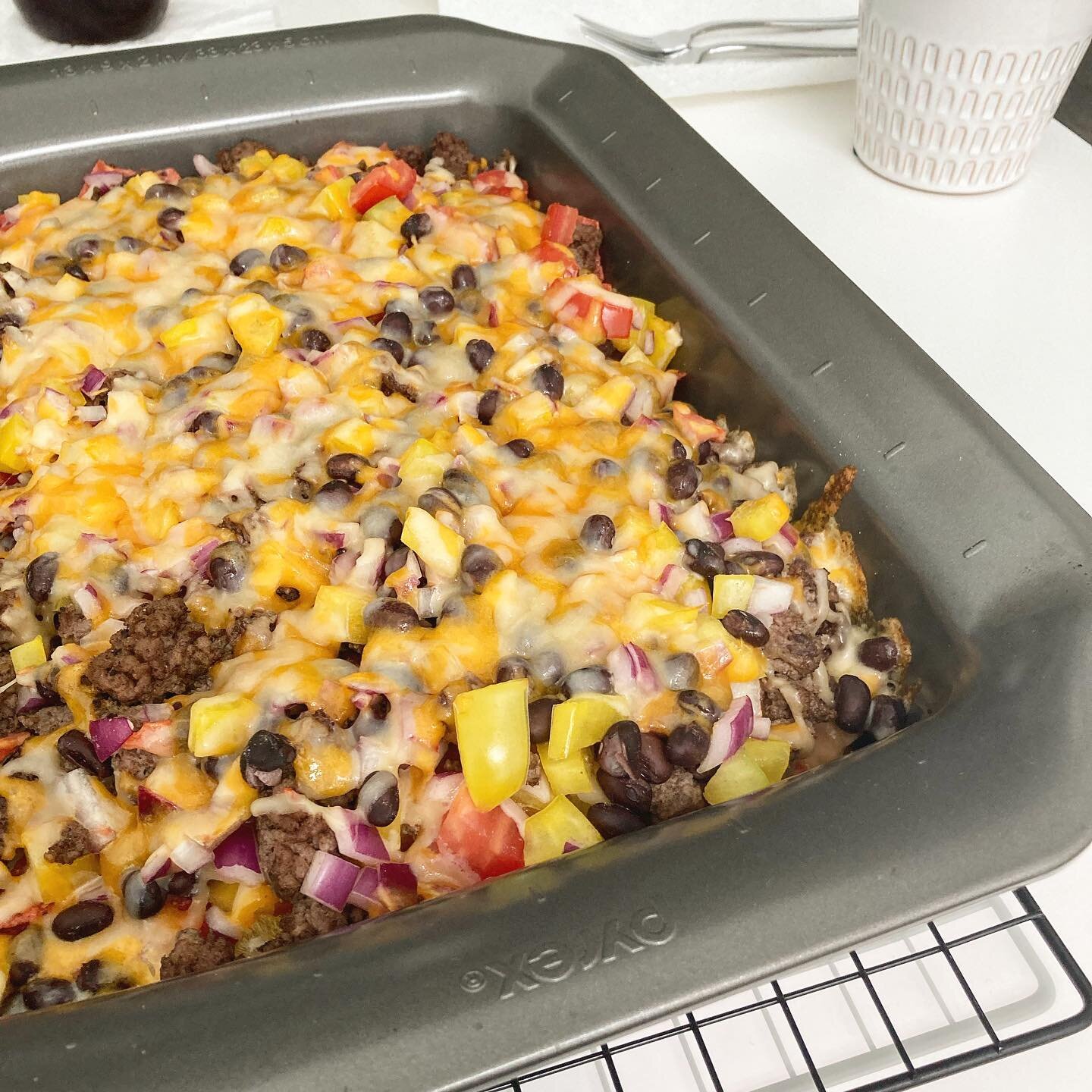 Enjoying some nachos while watching Euro 2020 ⚽️ These nachos are loaded with black beans, ground beef, chopped bell pepper, tomato, red onion and topped with grated cheese 😍⁣
⁣
Fun Fact: before I took up running competitively, I played soccer for 1