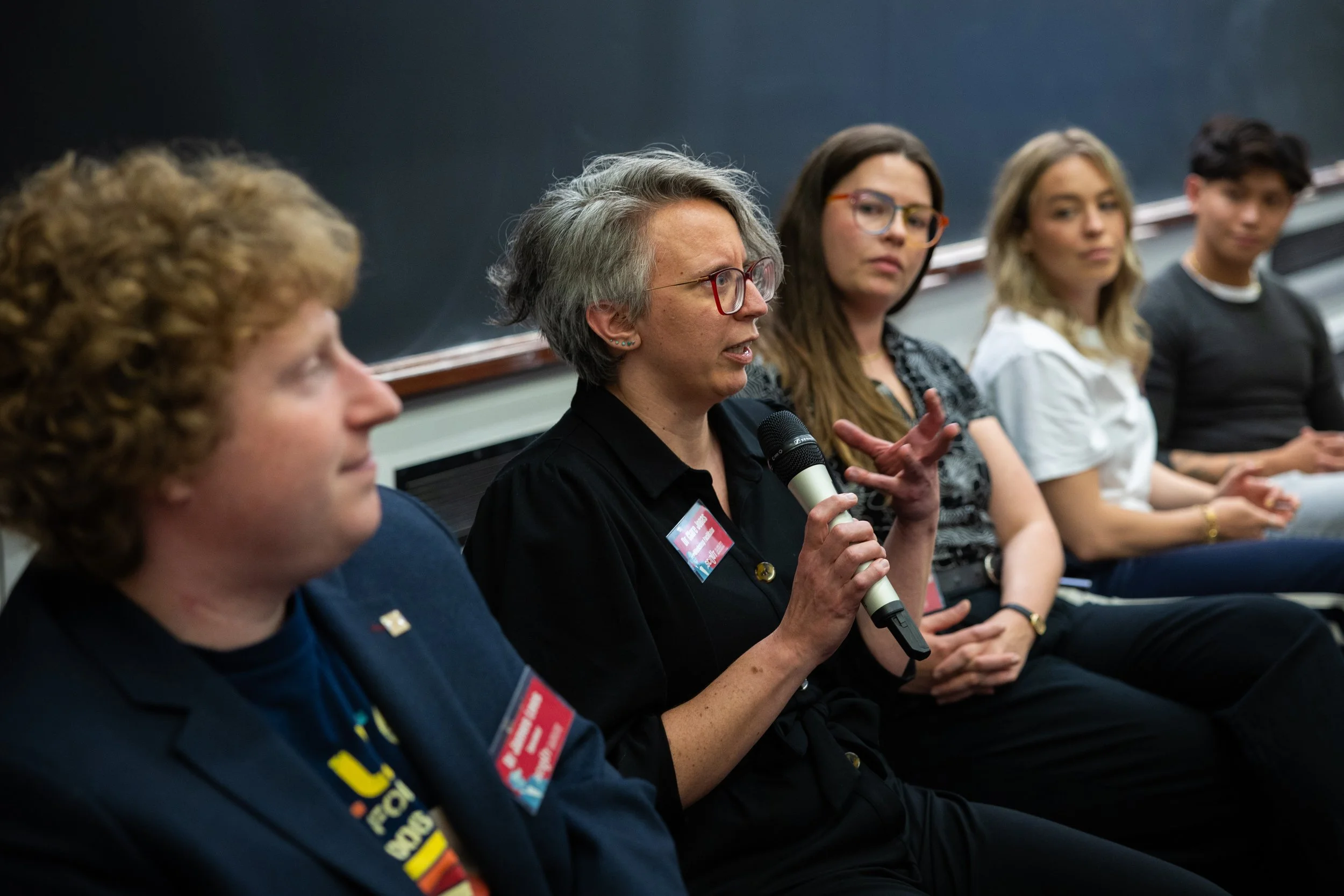 Clare sitting on a panel of five science communicators (Dr James Lees, Dr Maren Hunsberger, Dr Katie  Hutchinson, Dr Gab Astorga) at SciOut 2026. Photo credit: Ilaria Dimina and Leonardo Solidaro.