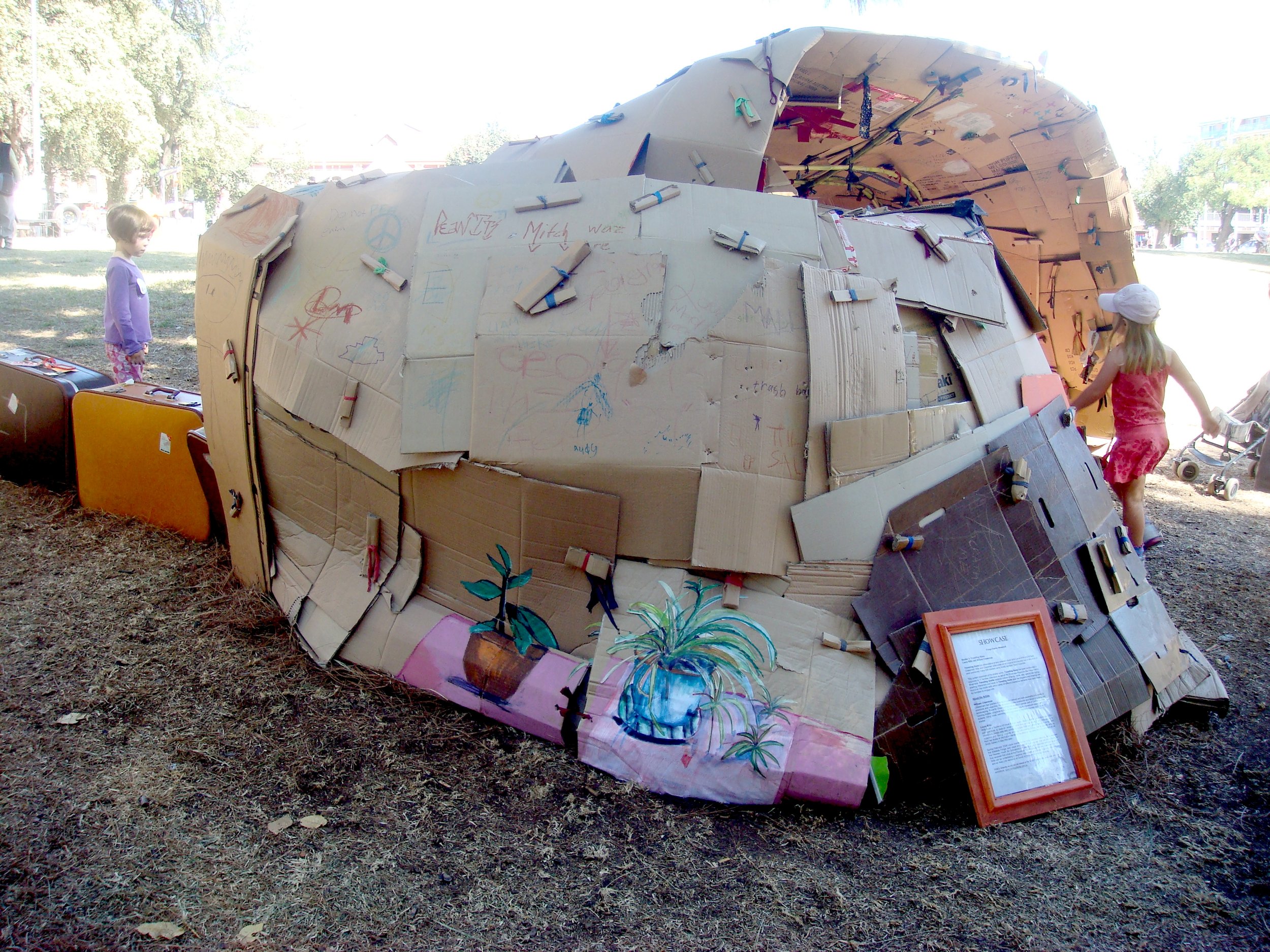   Shelter #3,    Travelling Home   ,  2008 Rhymil Park, Commissioned for Fringe Family Weekend, Cardboard, material, pencils, books, suitcases, cane 