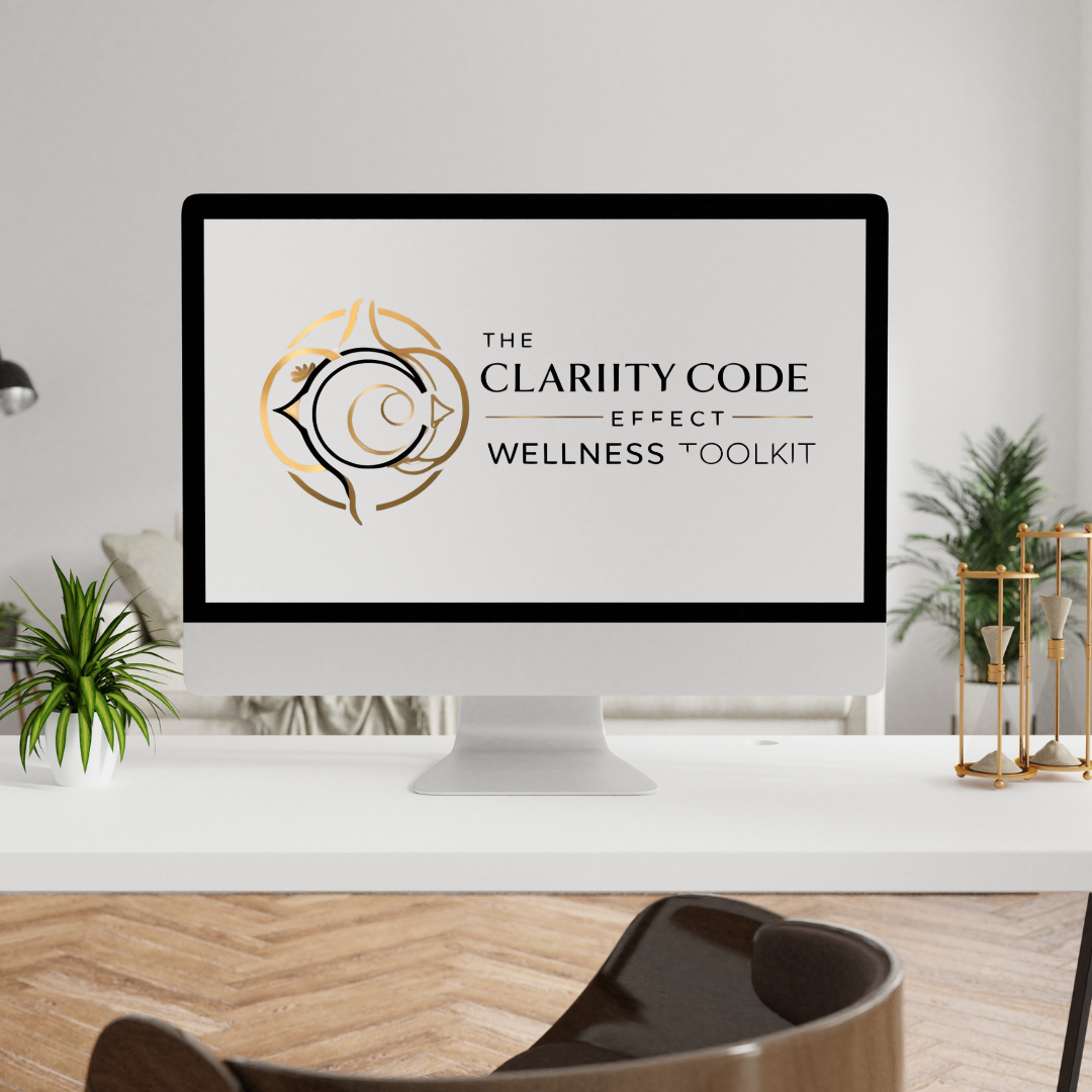 Computer monitor displaying the logo for The Clarity Code Effect Wellness Toolkit in a modern office with plants and decor.