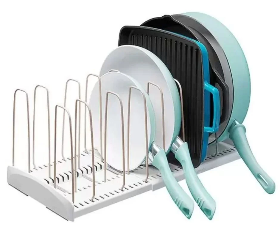 versatile organizer that creates custom storage for pots, pans, and more, with adjustable dividers and non-slip feet. White organizer holding teal pans vertically