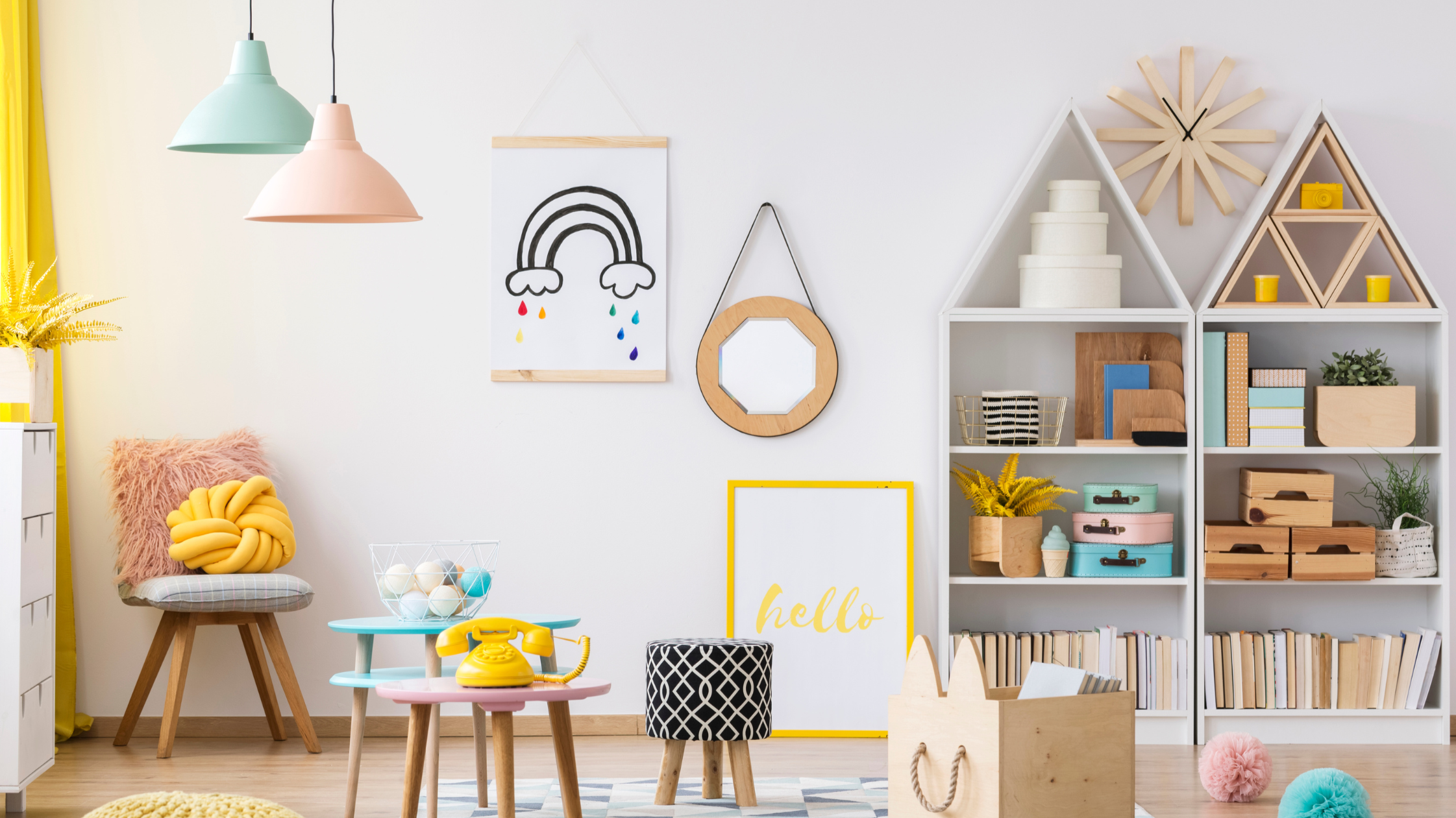 Image of an organized playroom with yellow, mint, and light pink accent pillows, lights, and toys.