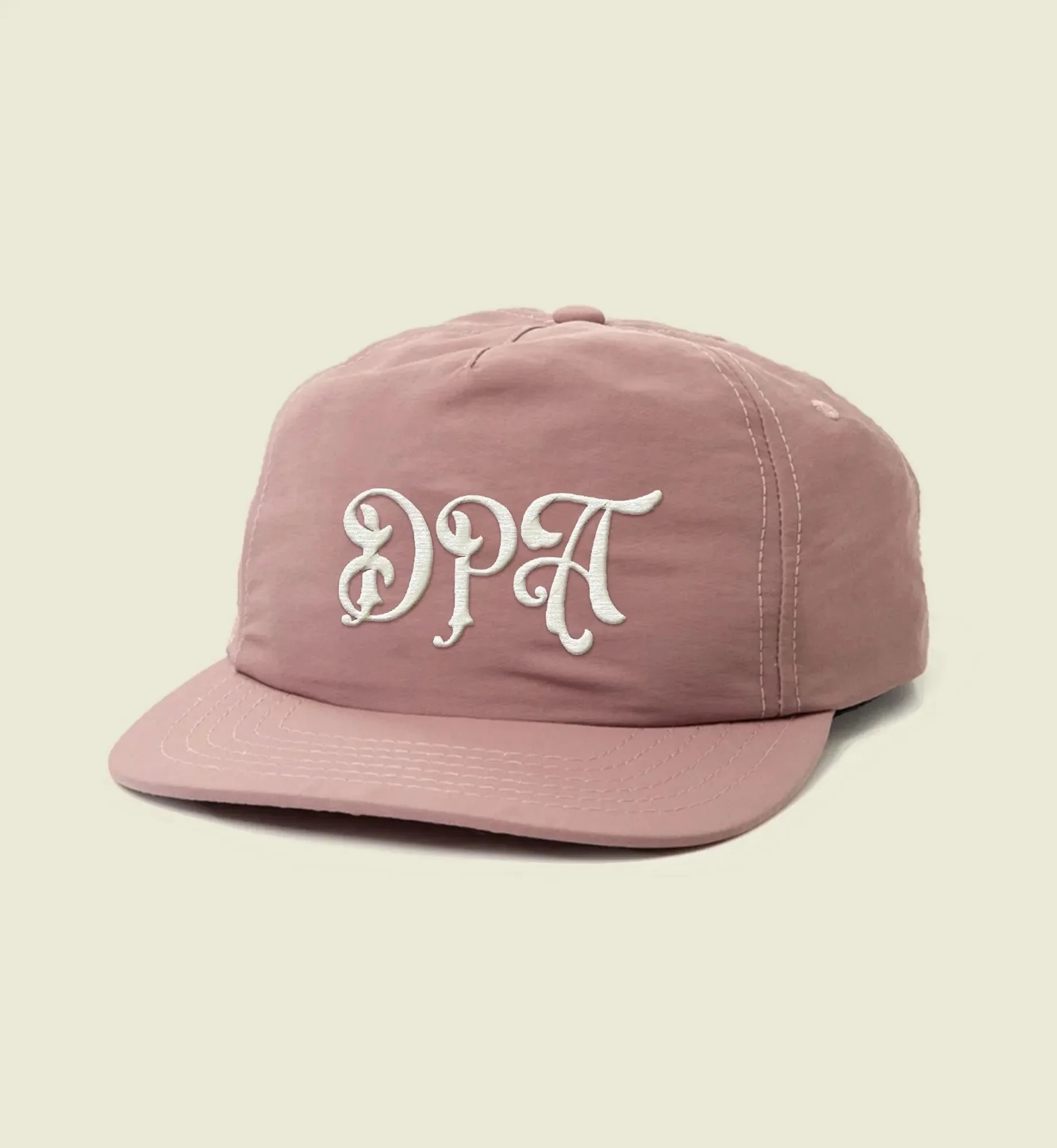 vicarel-studios-great-divide-brewing-dpa-script-hat-cream-backdrop.webp