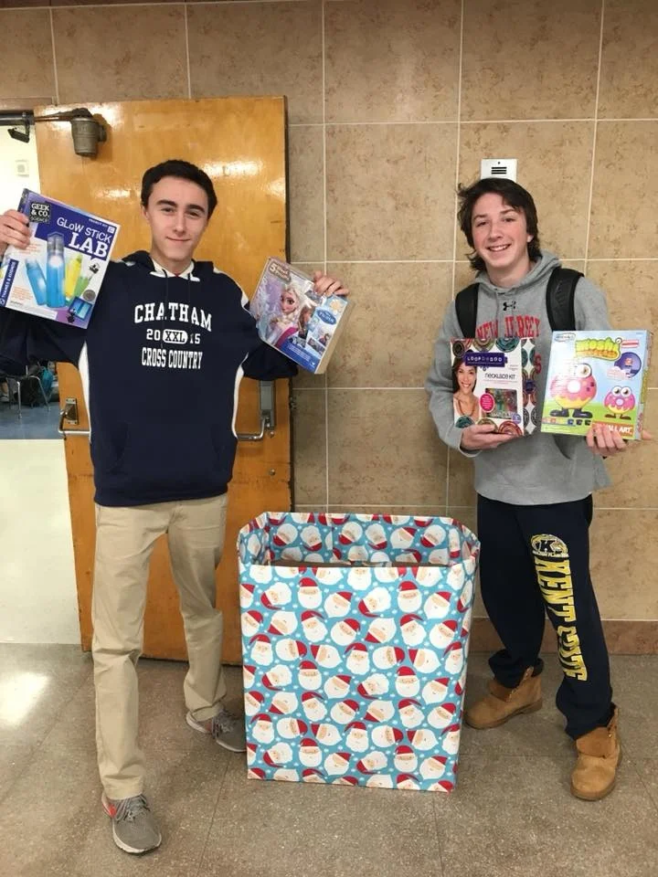 Ryan’s cousin Matt (right) spearheaded a Ryan’s Toy Roundup at Chatham high school to benefit Deirdre’s House.