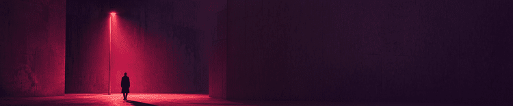 Magenta light illuminating a lone figure in dark futuristic architecture