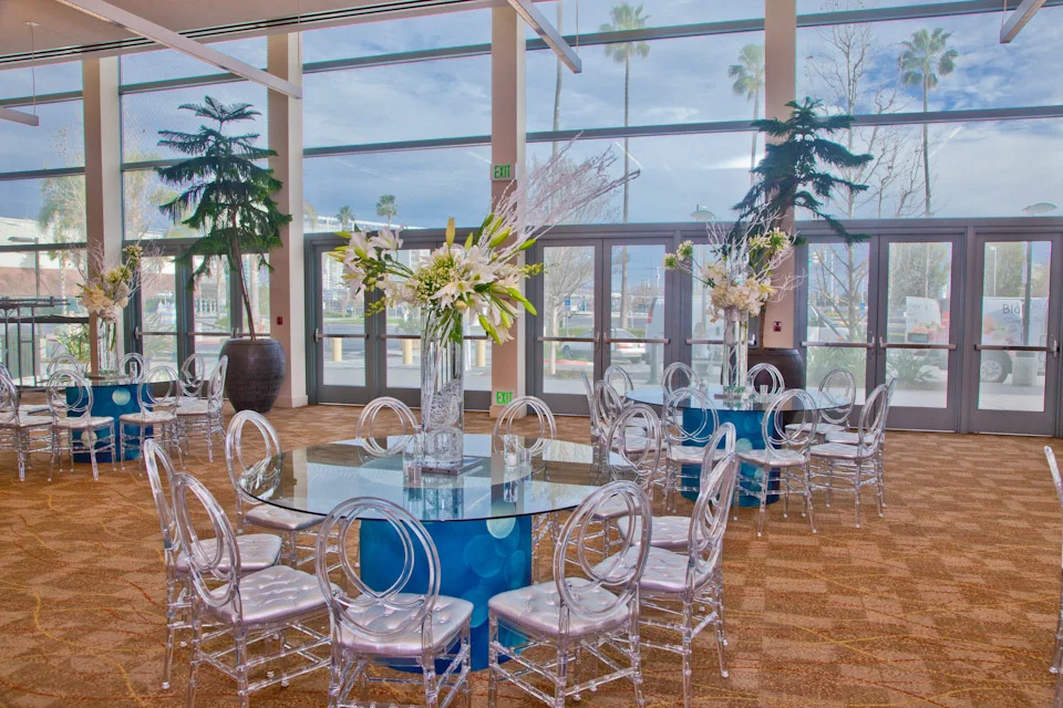 Event chairs and tables set near the entrance of the facility