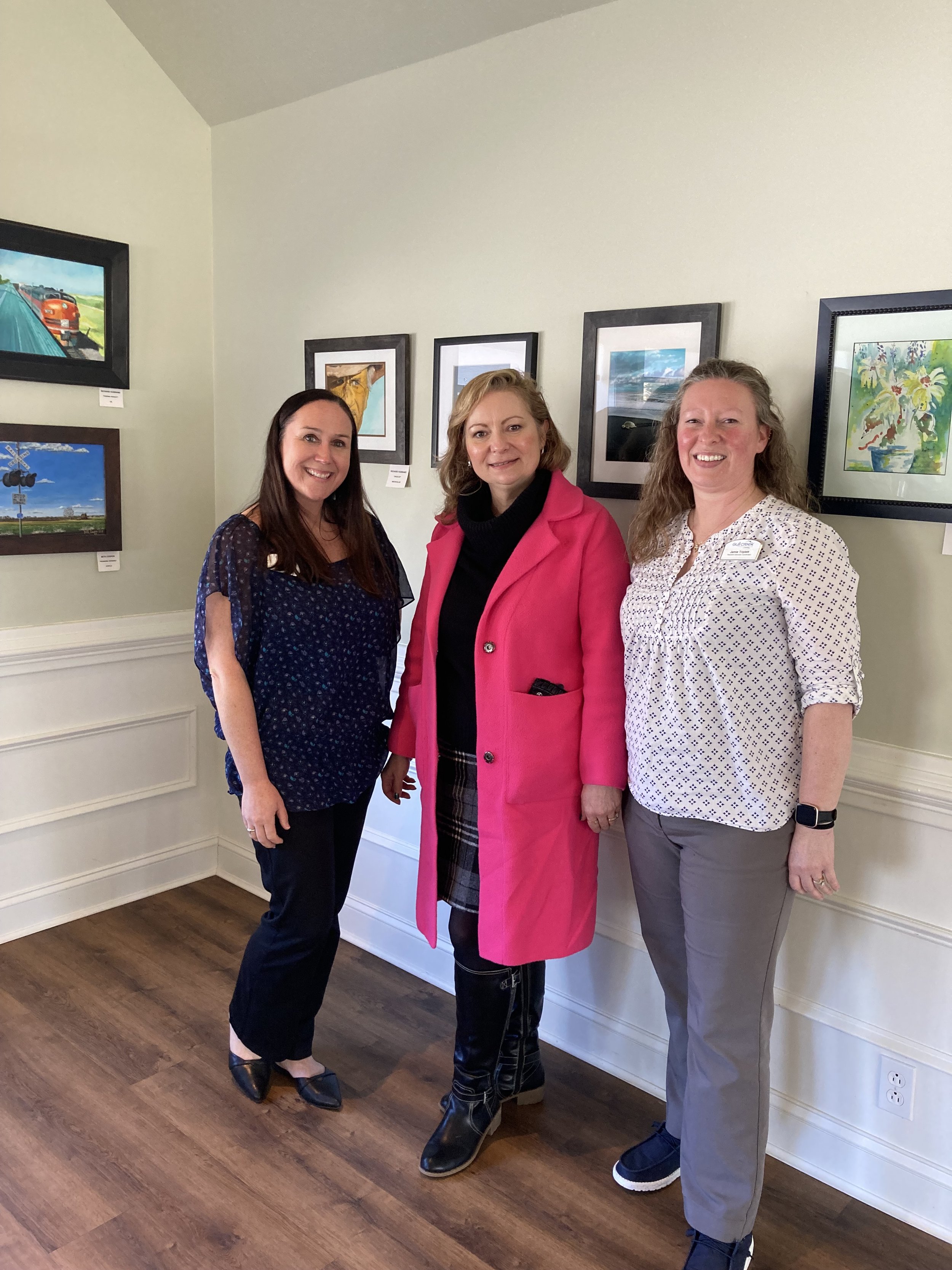 Megan Richmond - Marketing Director, Anna Mullis-WCAC Executive Director, and Jamie Tripletts-Resident Services Coordinator-Enjoying the artwork at Gull Creek