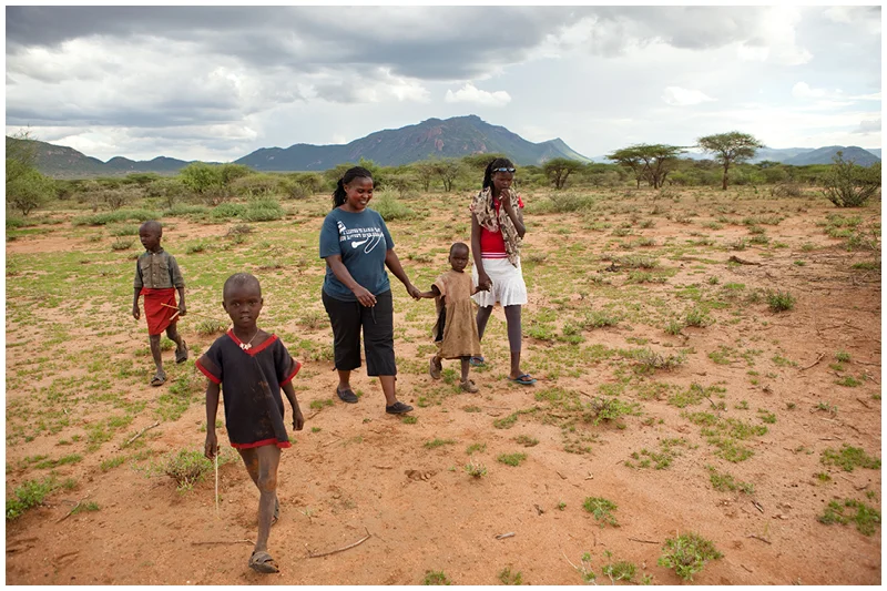 Kate visits the family manyatta of one of the girls who EO supports (far right). Unfortunately their mother has left the family and their dad is an alcoholic and so the children are hungry and their clothes are threadbare.