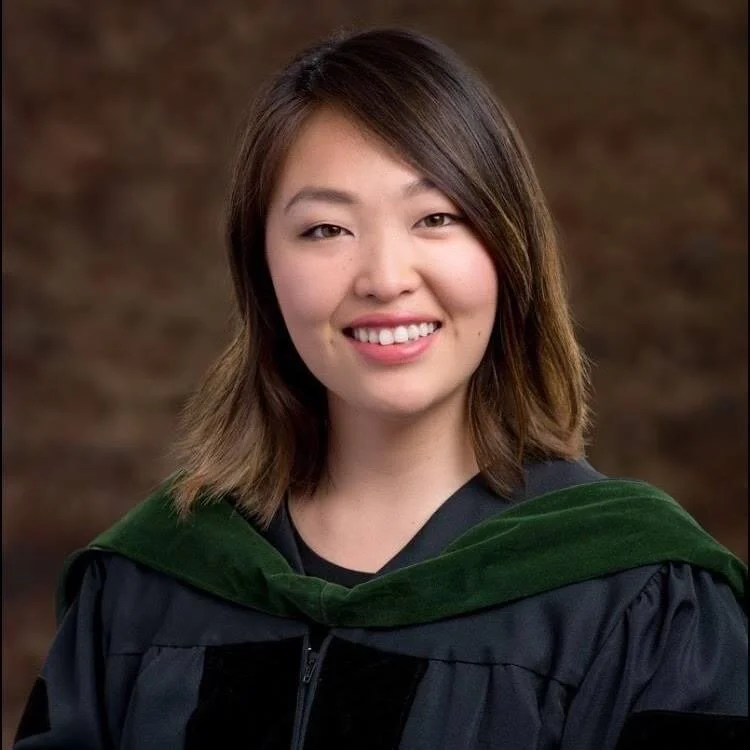Dr. Tak smiling in regalia