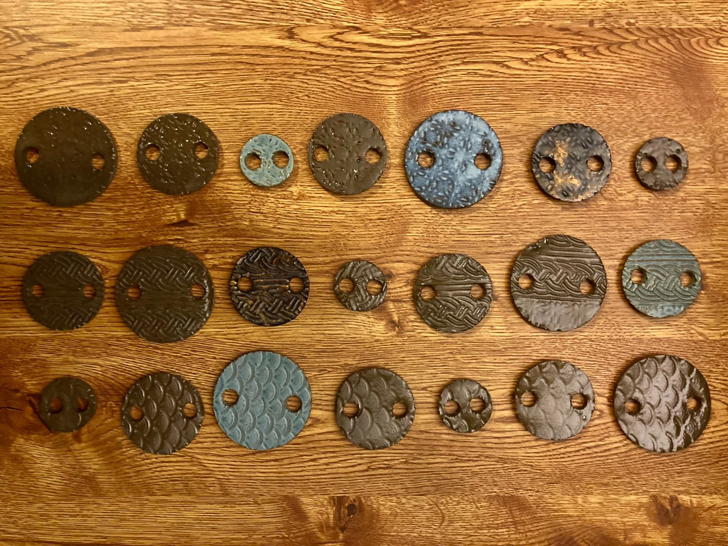 Pieces of the wind-chime, before they were strung together and suspended under the bell part.