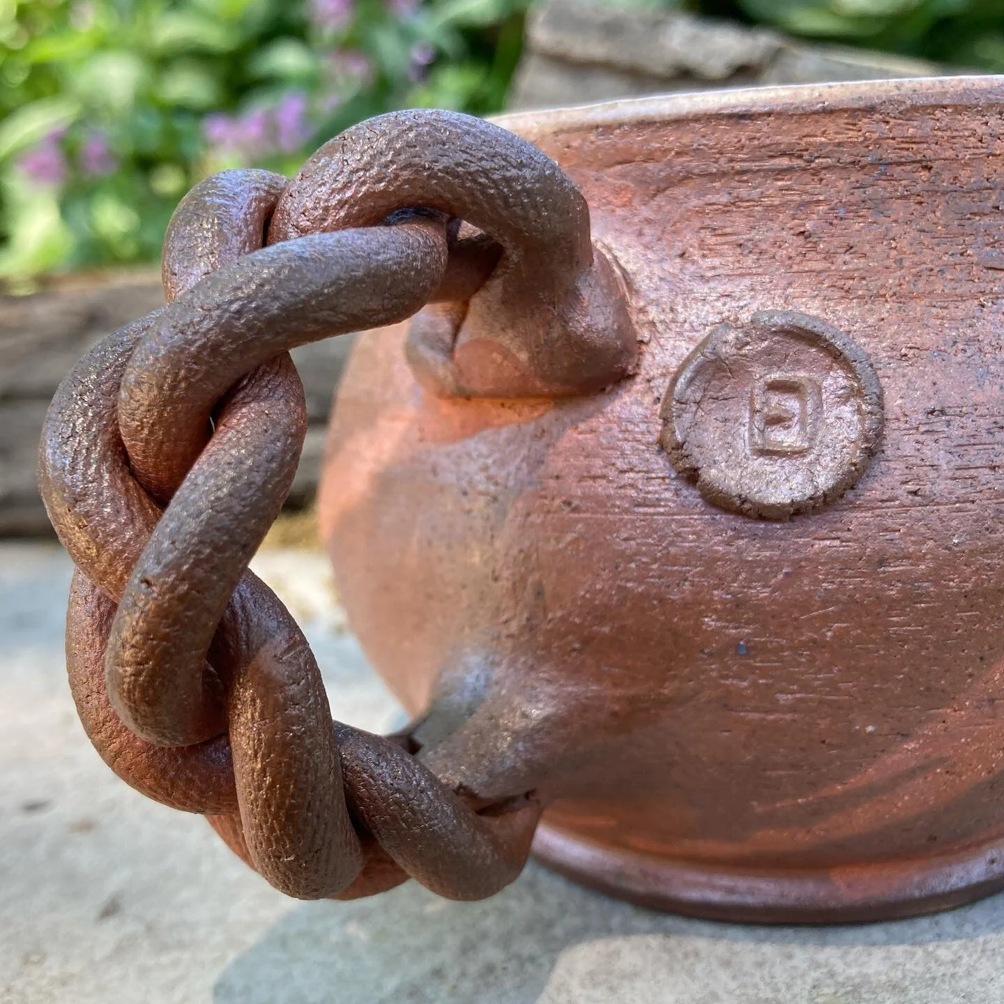 Meet “Sm(a)ug,” a cup born of fire and wood ash. 
•
My first woodfiring experience in 2017 made me want to explore surface designs with flashing slips more this time. Thus the use of a fine-tipped bottle to apply the claw marks on th