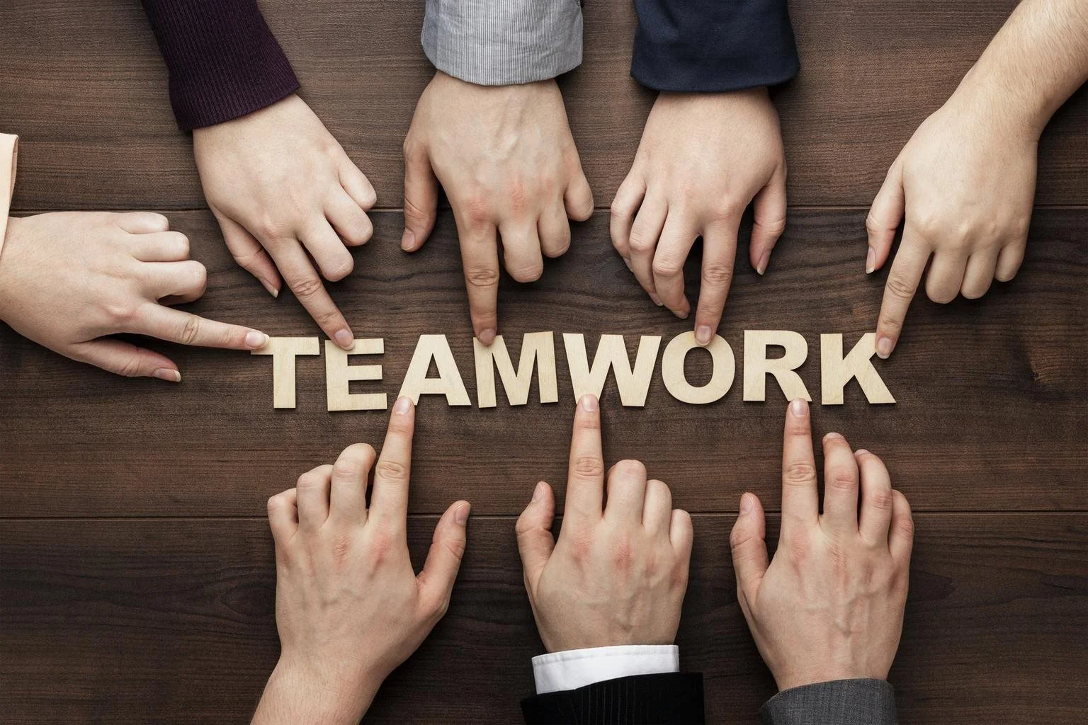 6532431a769b1188055b60c1_teamwork-concept-on-the-brown-wooden-table-background.jpeg
