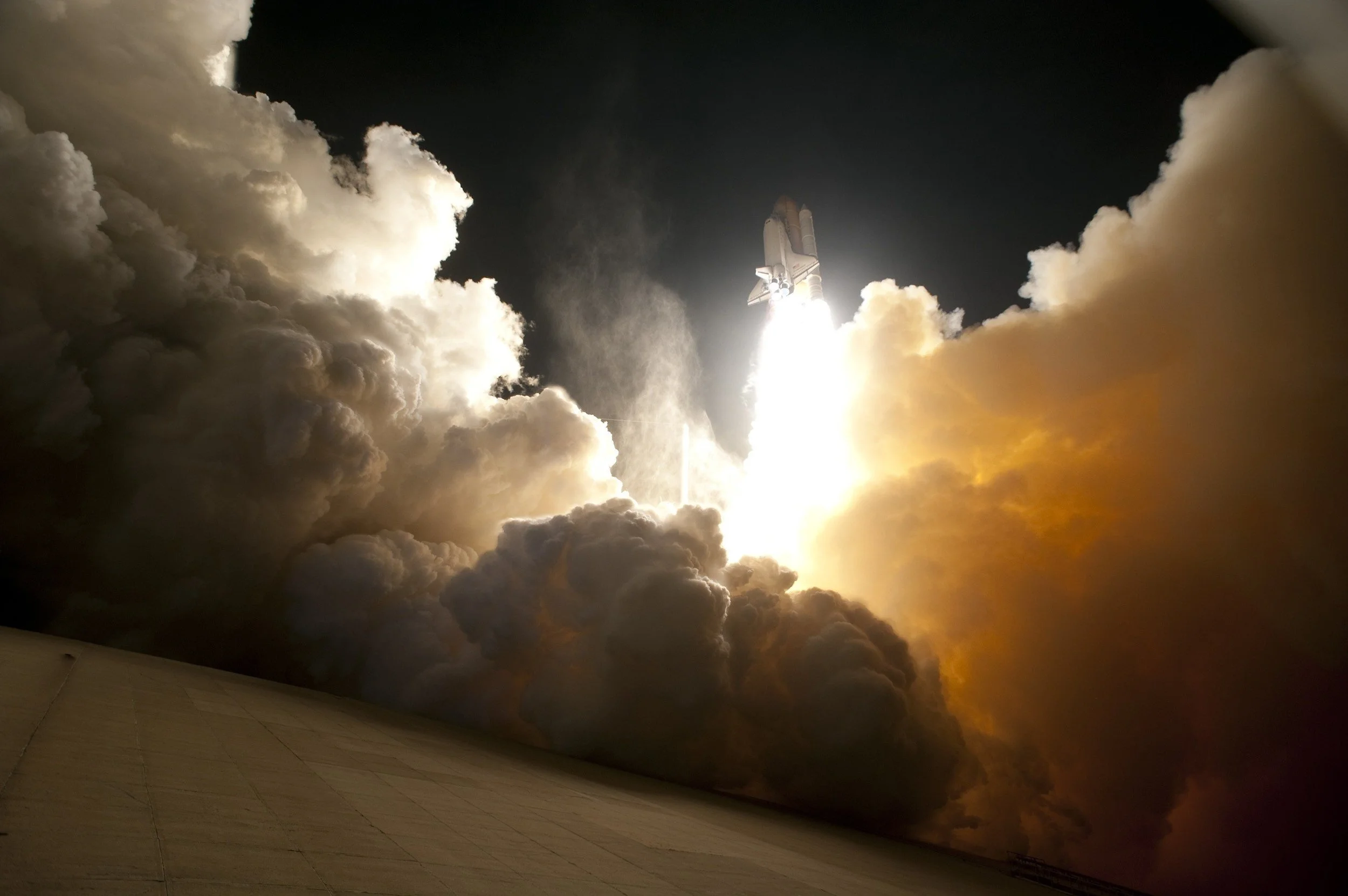 rocket-launching-towards-sky-with-clouds.jpg