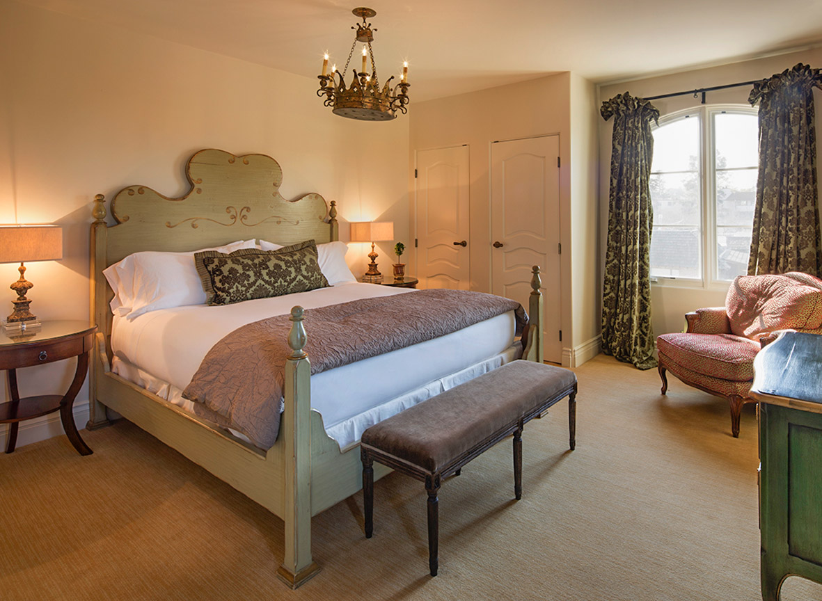 The master suite bedroom at Enchanté Hotel.