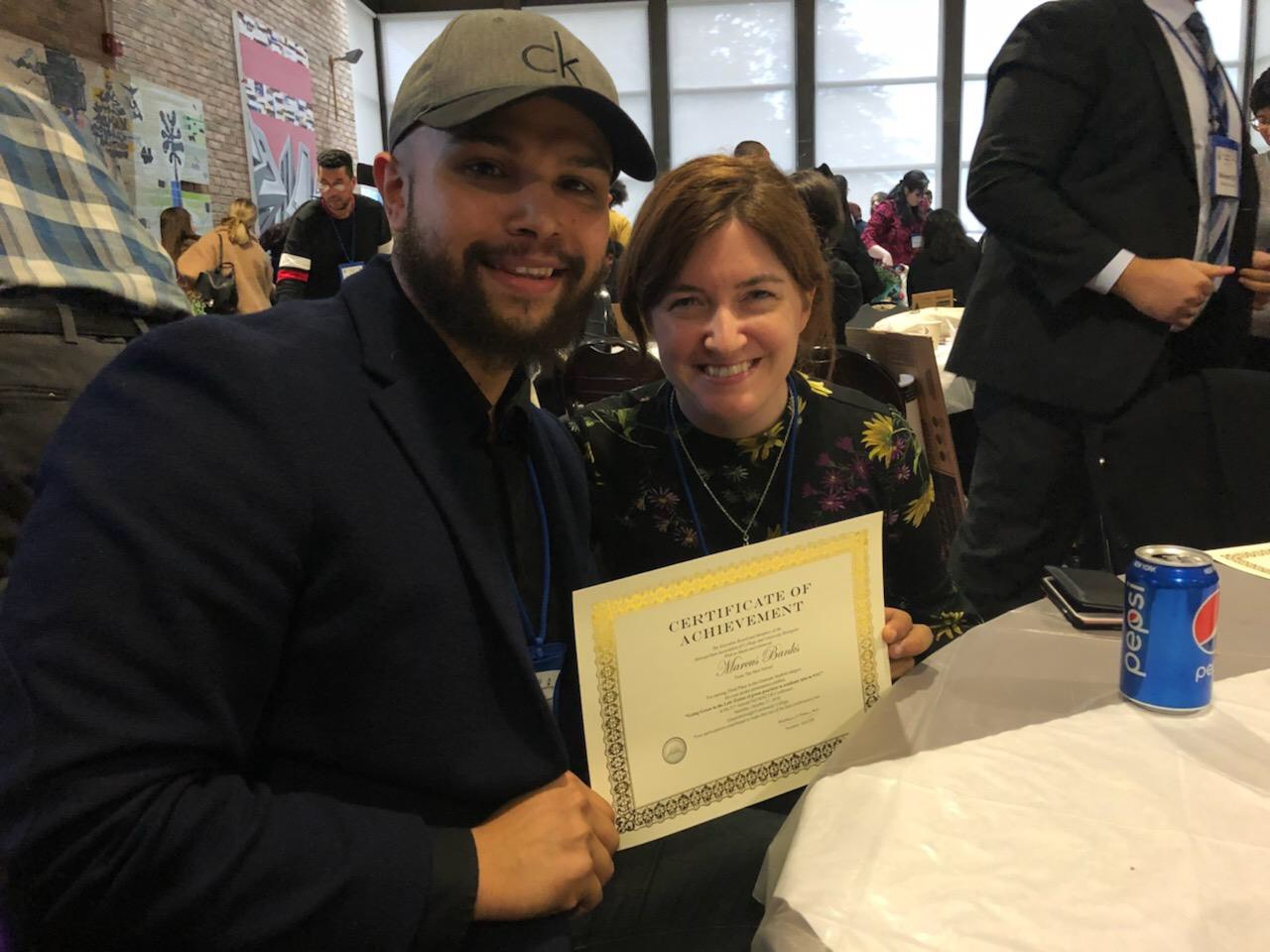 Marcus Banks, Lab Manager with his poster prize and his mentor Davida Smyth, Associate Professor of Biology