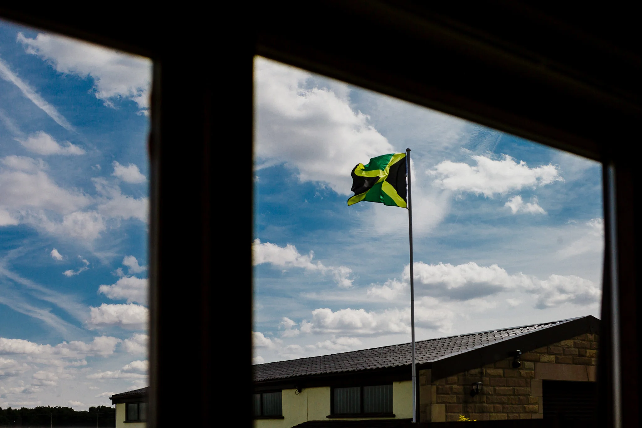 A jamaican flag flies above a yorkshire wedding venue