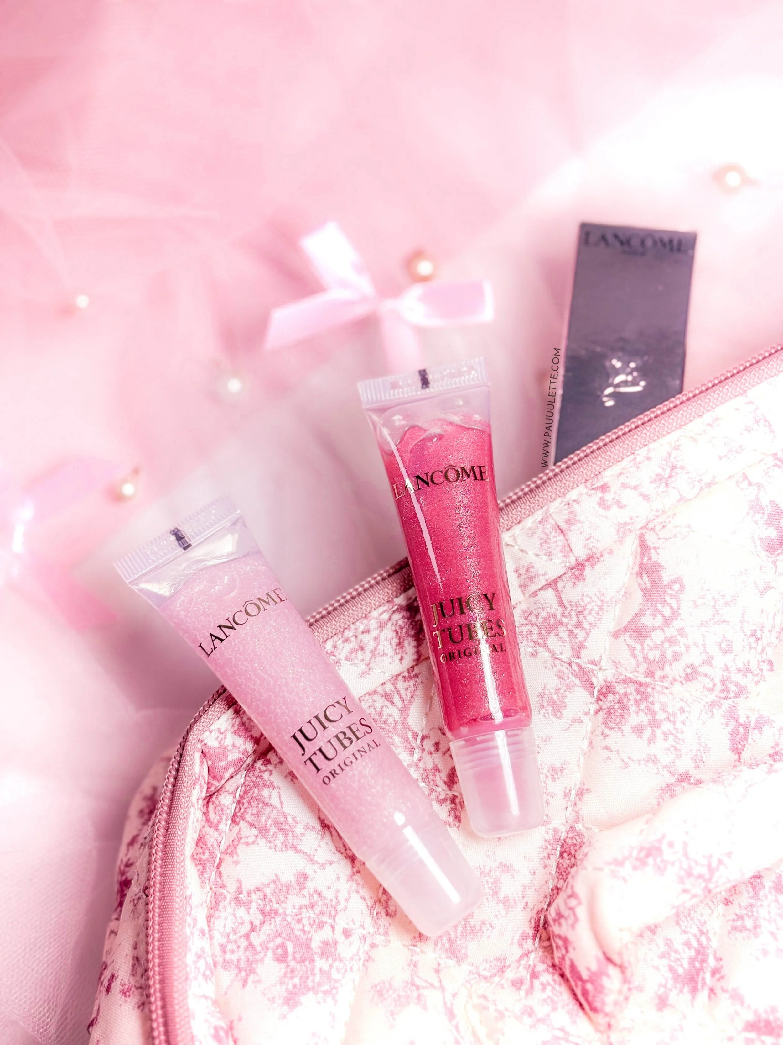 Gloss Lancôme Juicy Tubes teintes Marshmallow Electro et Magic Spell posés à plat