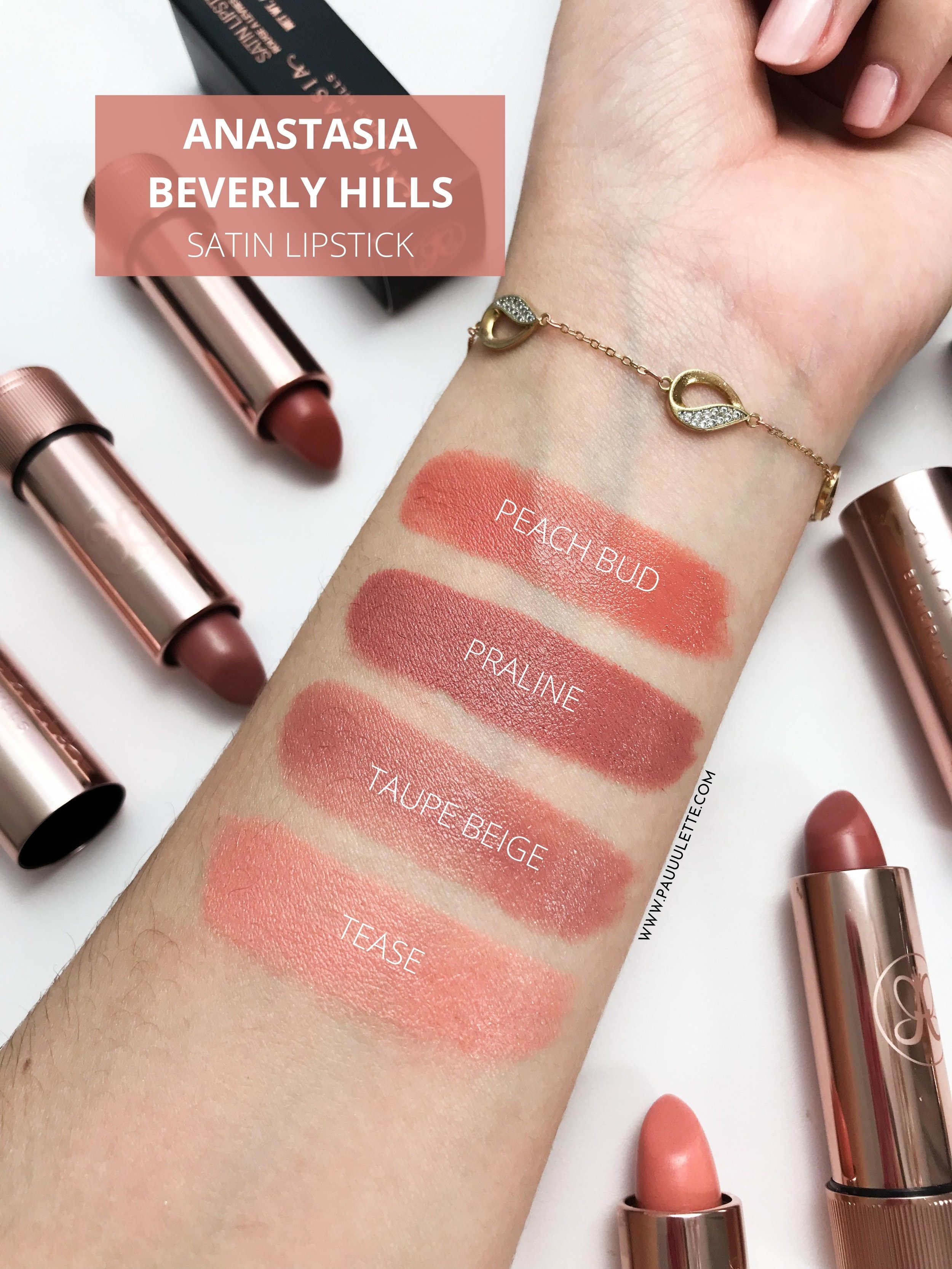 Swatches of warm peach, cool plum, and neutral taupe lipstick shades laid out on a mirror