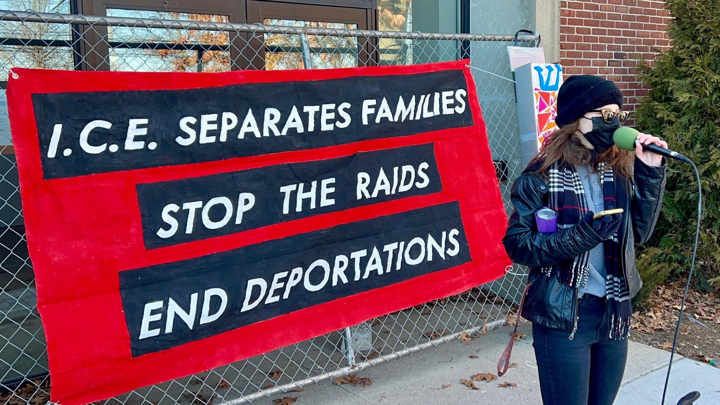 Demonstrators gather in Warwick to protest proposed ICE facility