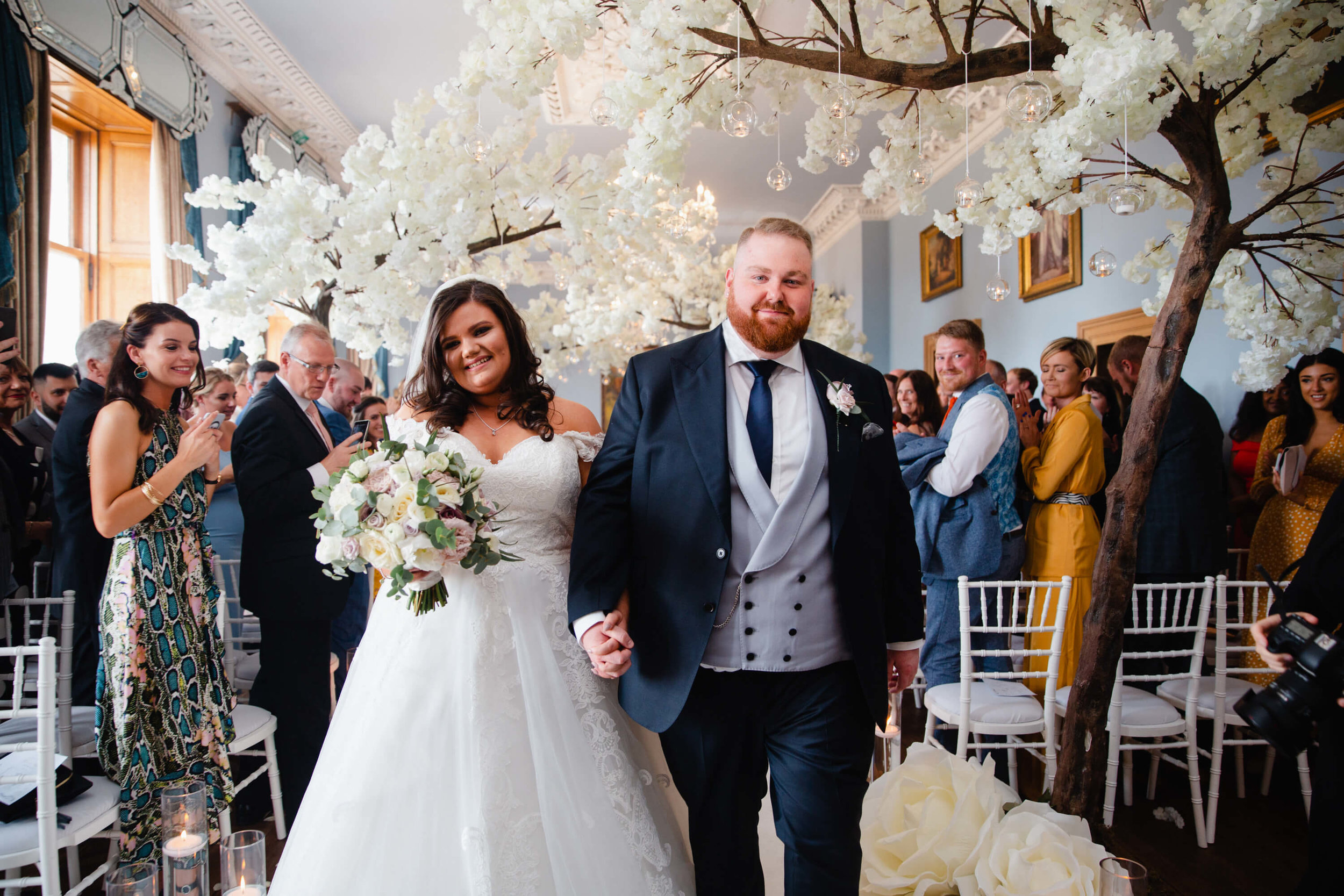 bride and groom with big smiles as wedding ceremony finishes