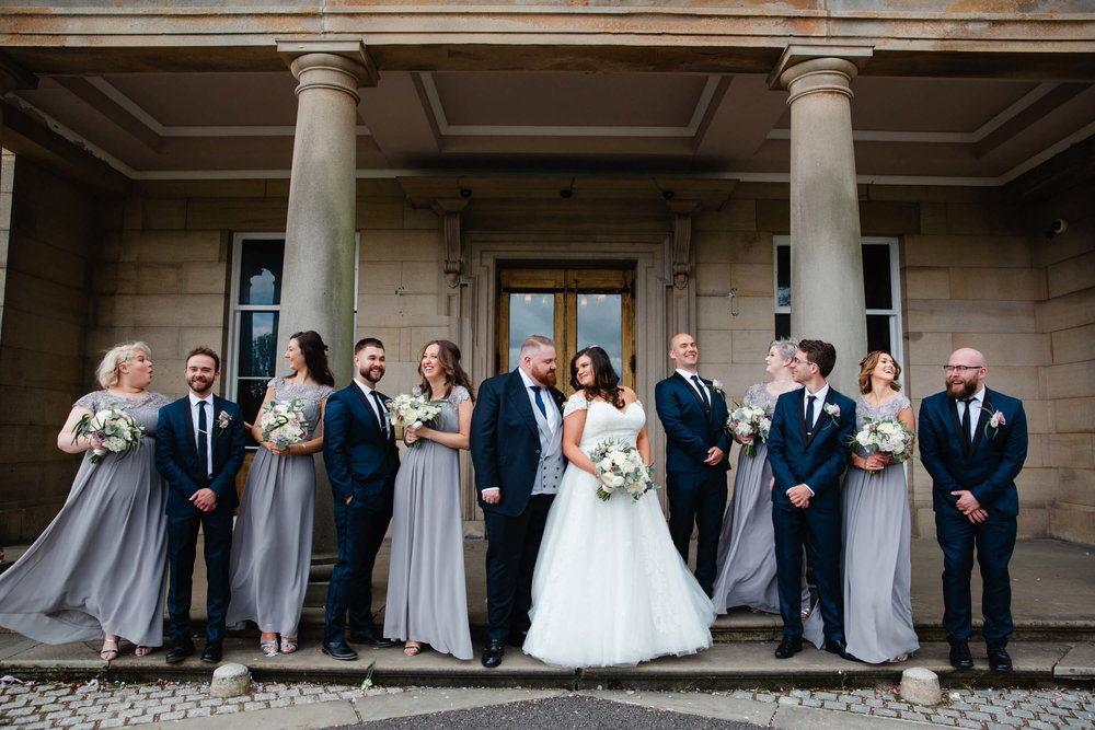 bridal party portrait in front of haigh hall