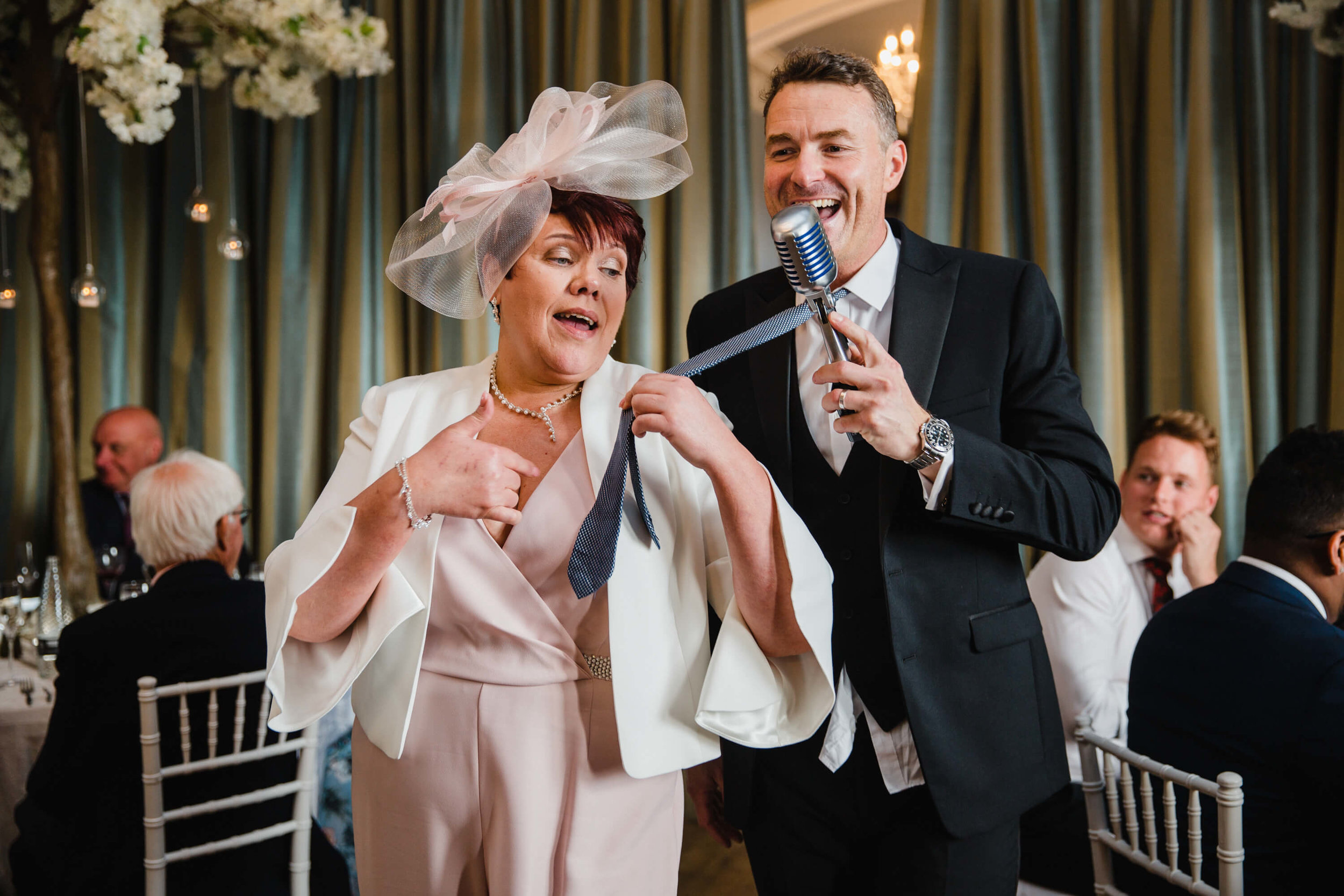 mother of bride pulling howard wing wedding singer by tie
