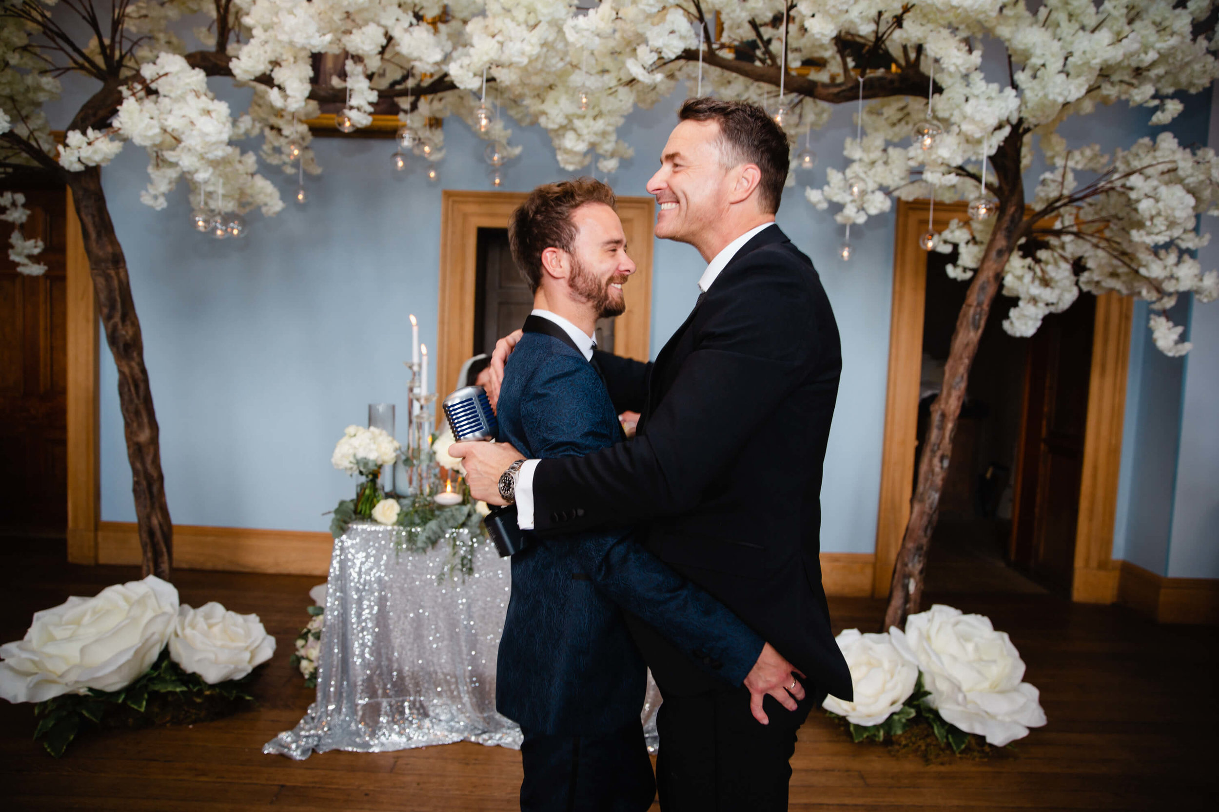 howard wing holding best man in dance
