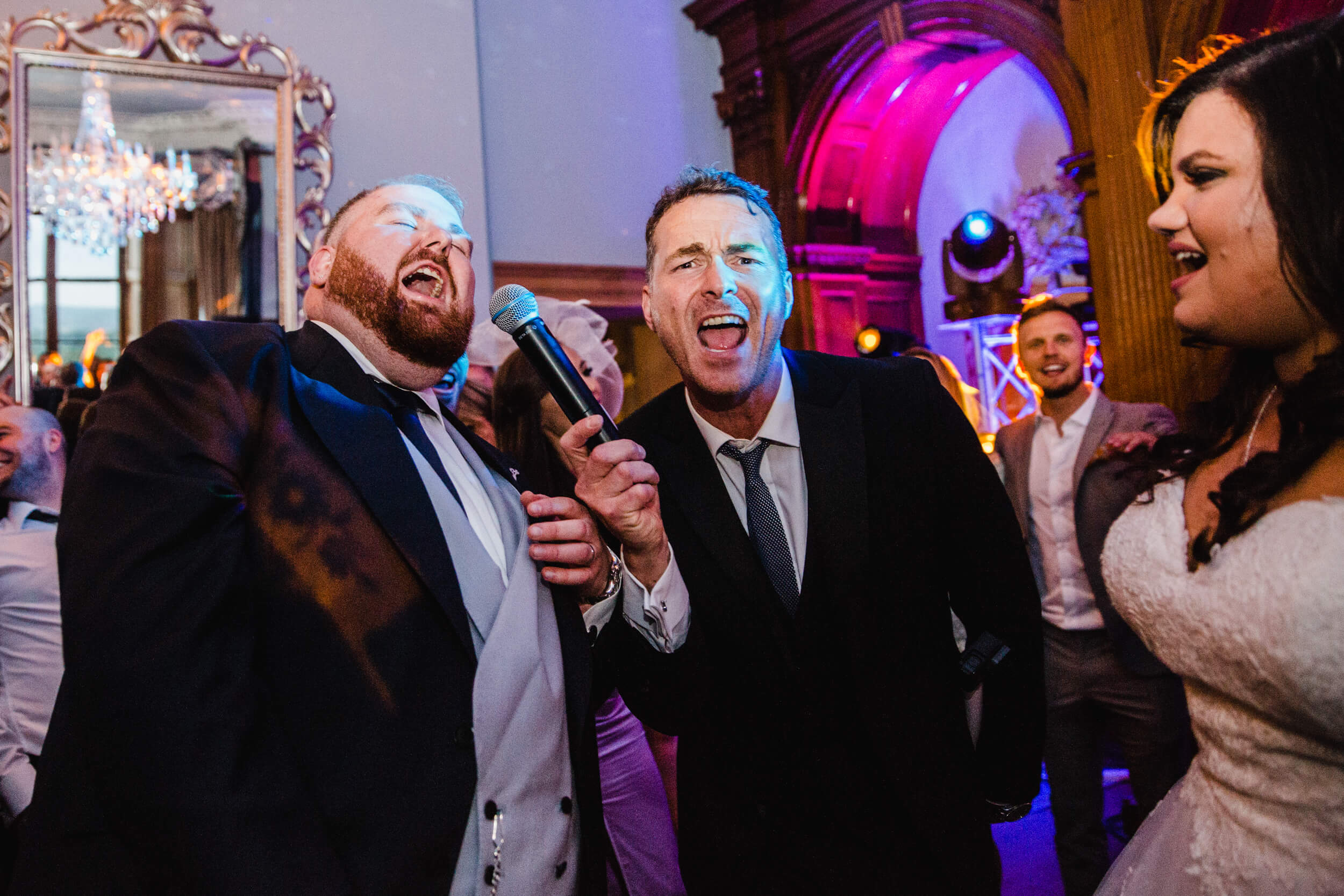 groom partying with bride at end of wedding