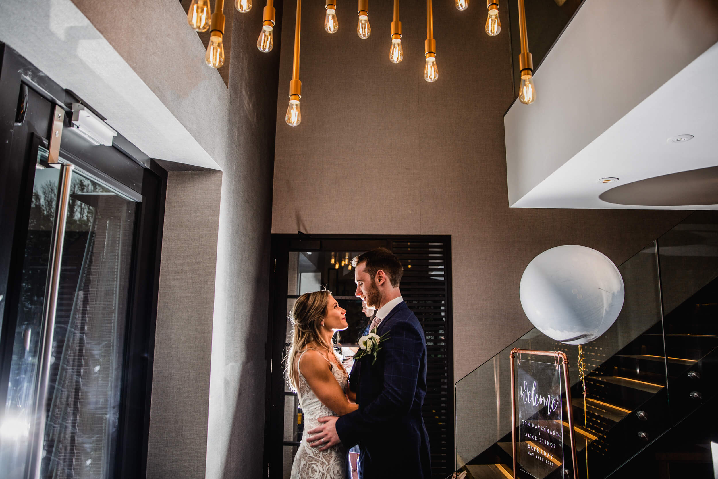 newlyweds pose for backlit flash photograph at The Colony HQ