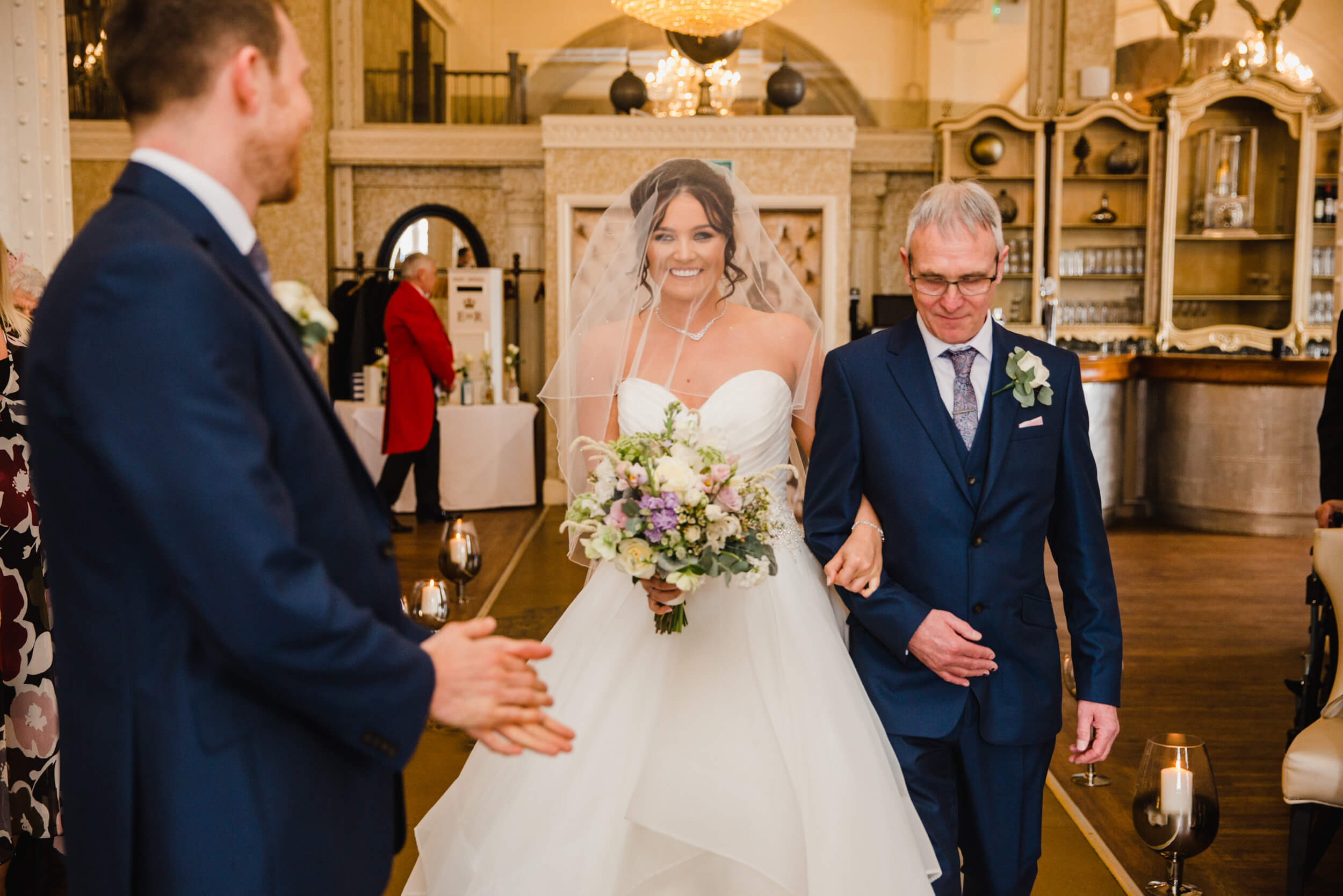 close up macro lens photograph of bride meeting groom during processional