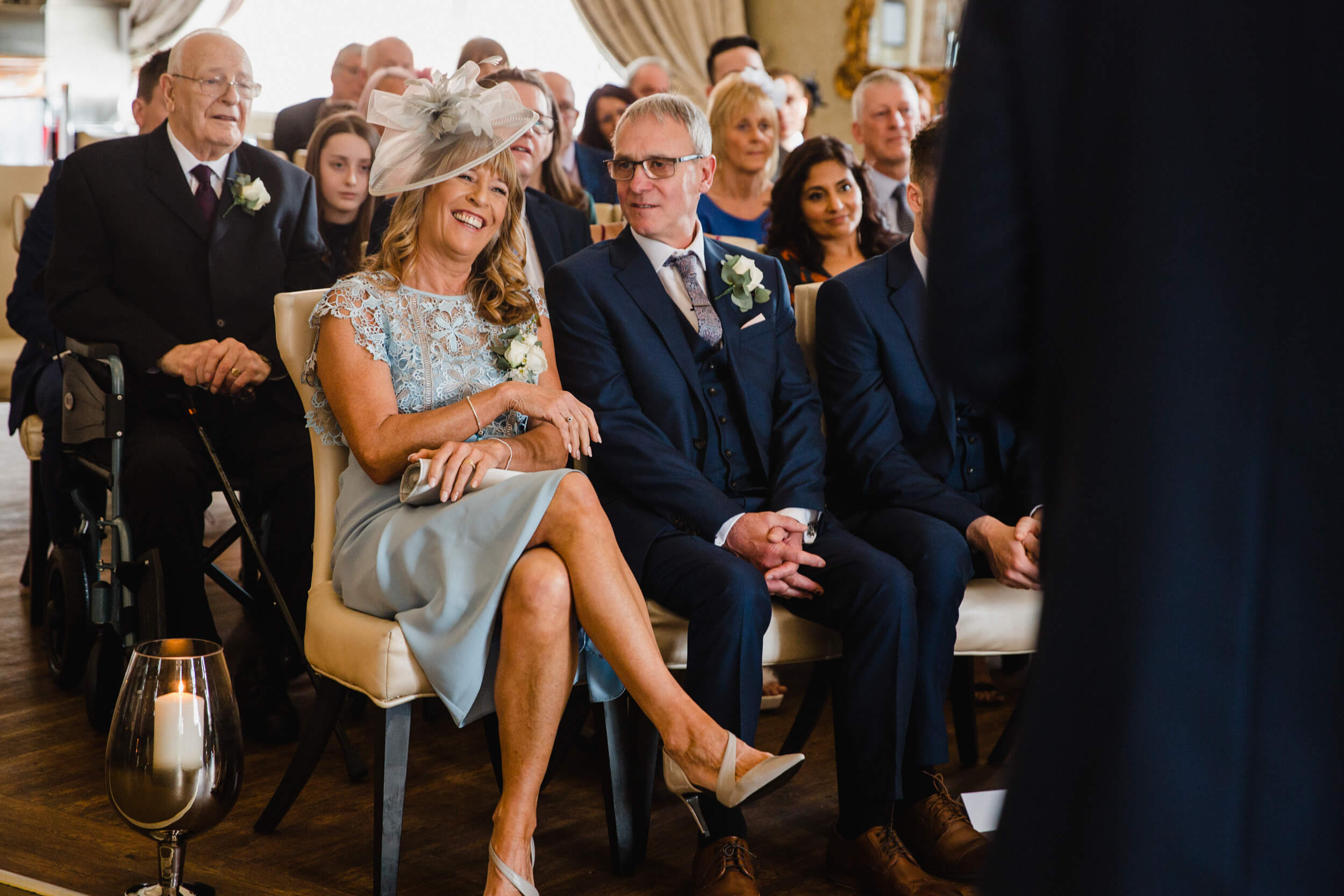 mother and father of the bride watching ceremony