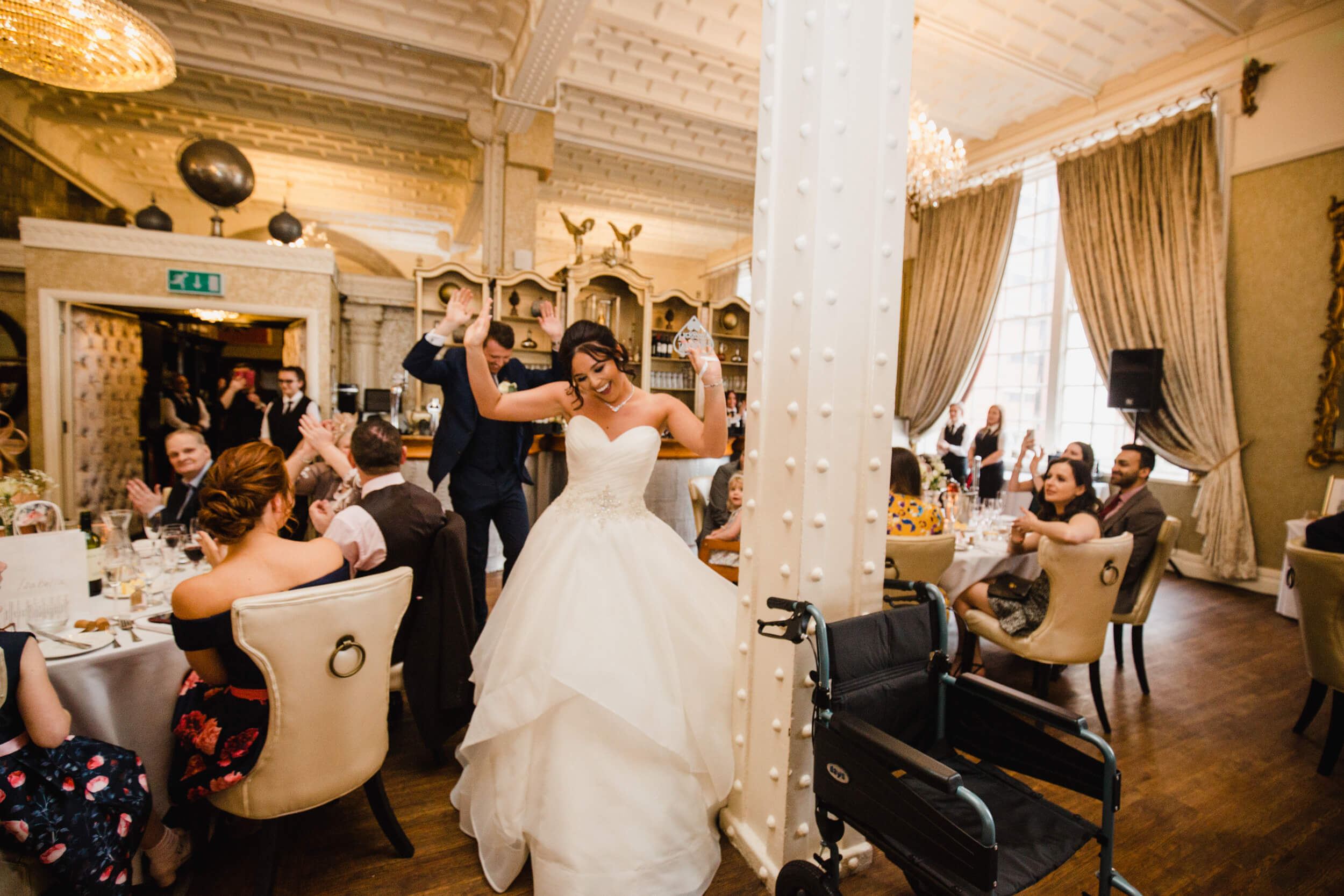 bride dancing when entering wedding breakfast room