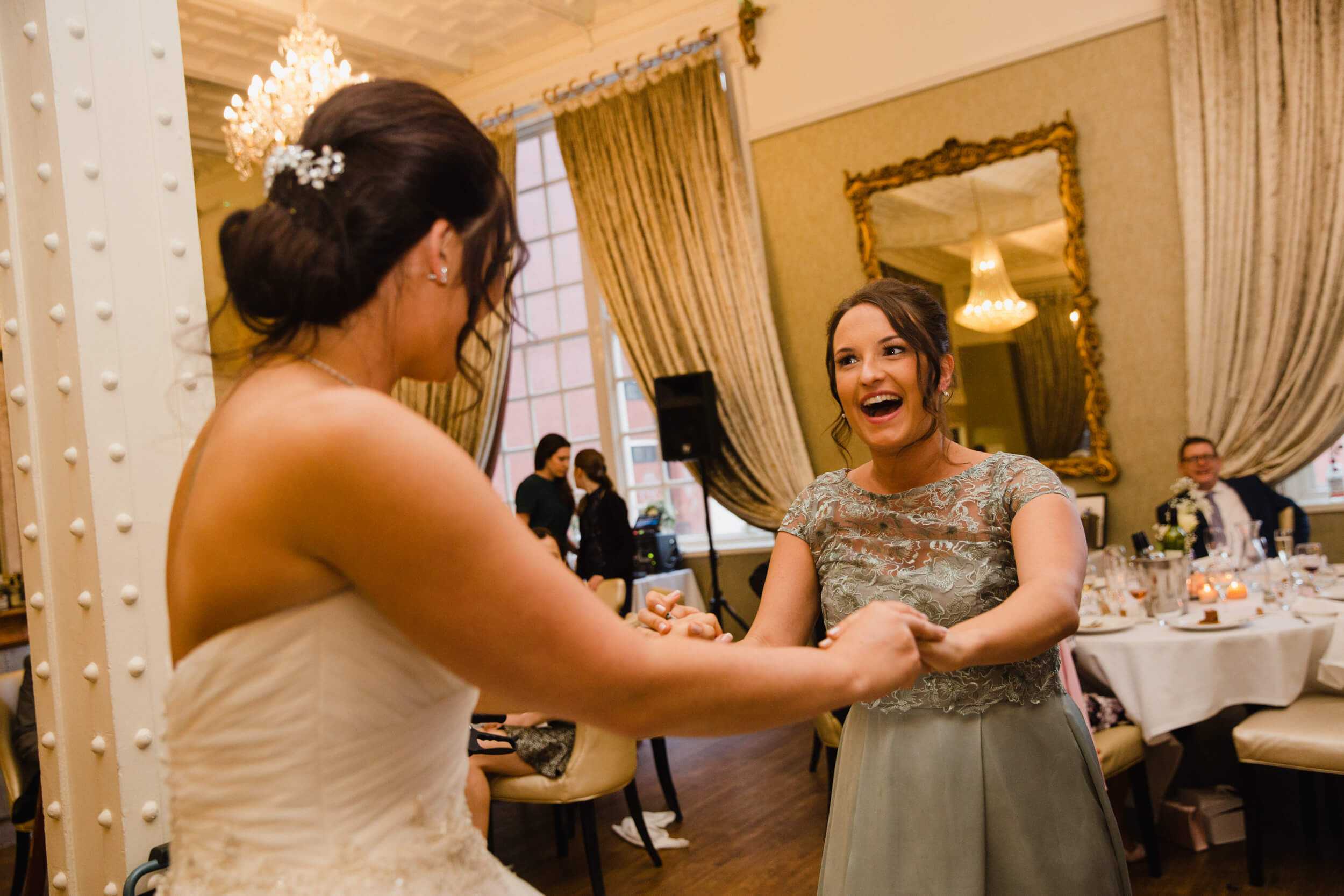 bridesmaid dancing with bride at 30 James Street Hotel