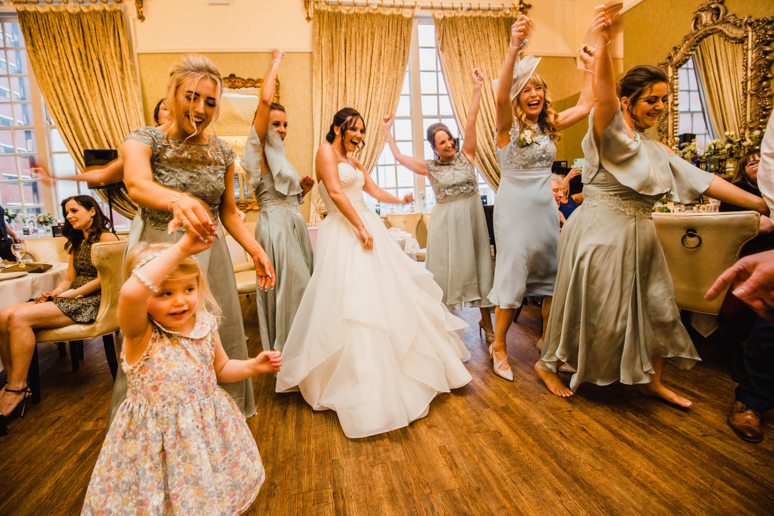 bride dancing with all bridesmaids together at 30 James Street Hotel