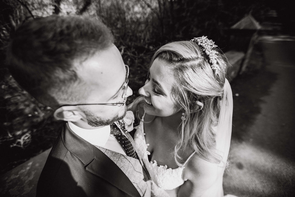 black and white intimate photograph of bride and groom