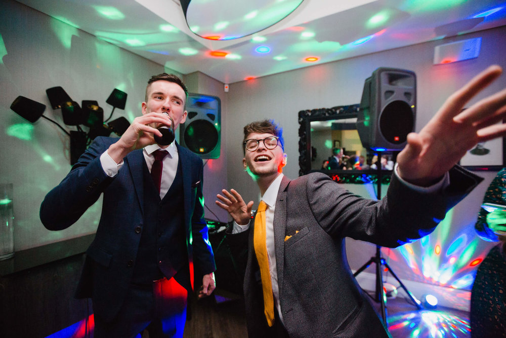 wedding guests dancing into the camera at oddfellows on the park