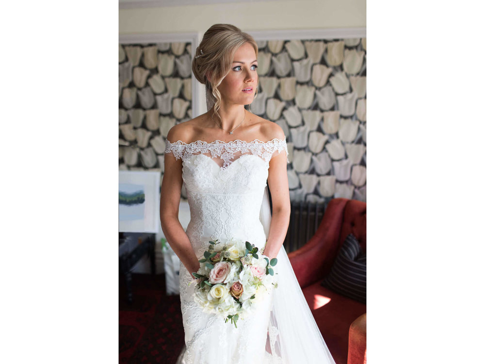 bride portrait holding bouquet of flowers at chateau rhianfa