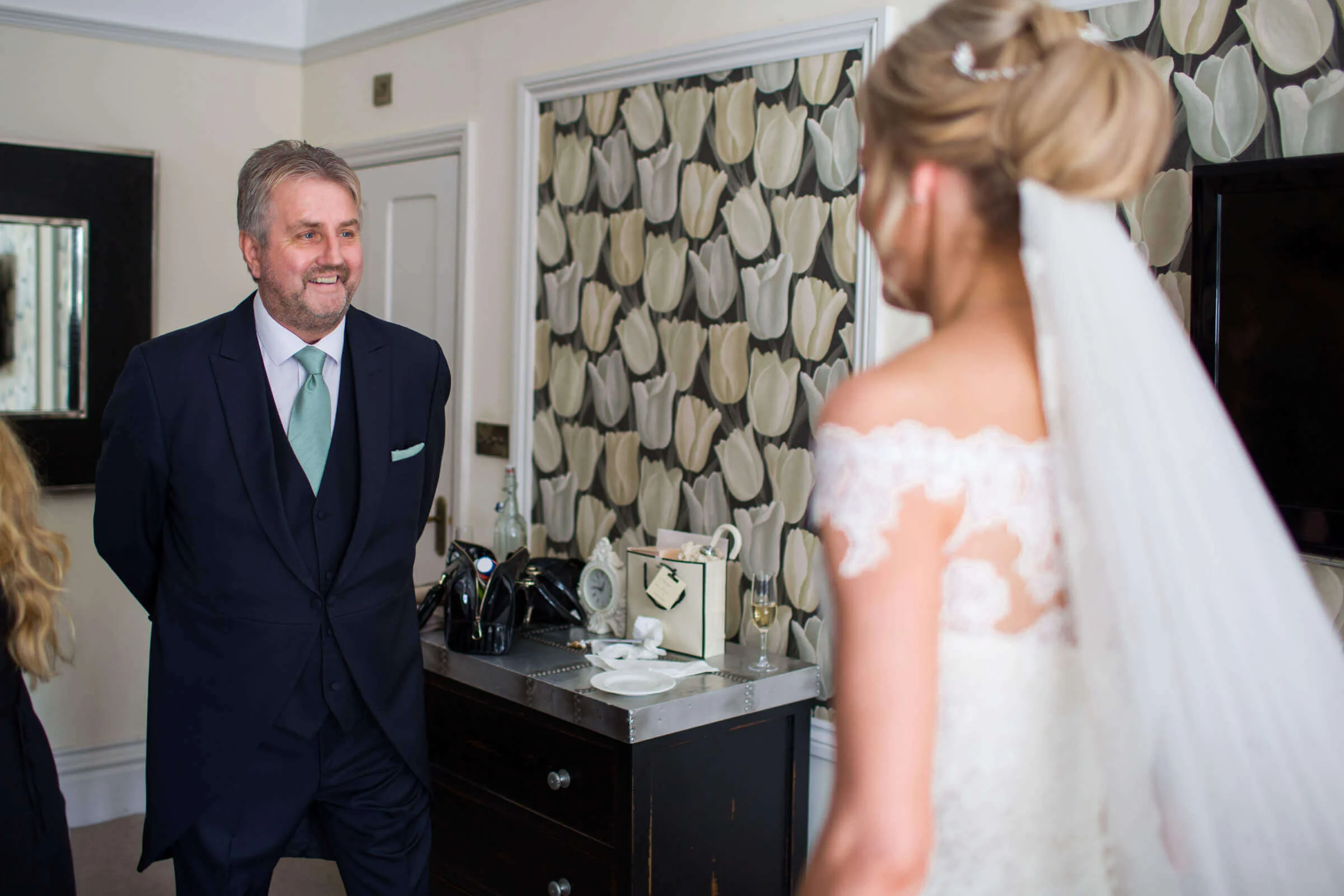 father of bride seeing daughter for first time at chateau rhianfa
