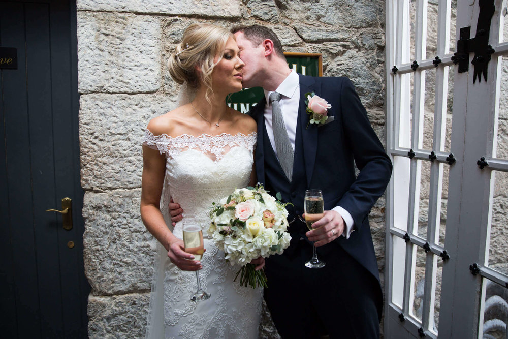 newlyweds share intimate kiss after wedding ceremony at chateau rhianfa